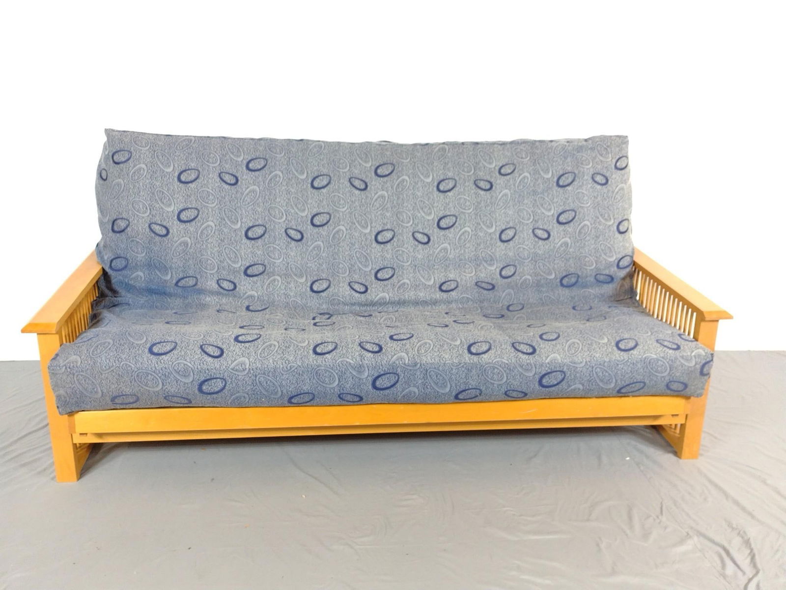 Futon: NOT ELIGIBLE FOR IN-HOUSE SHIPPING. 81" wide X 38" deep X 37" high. Has some scratches on wood frame. Also has some sun fading.