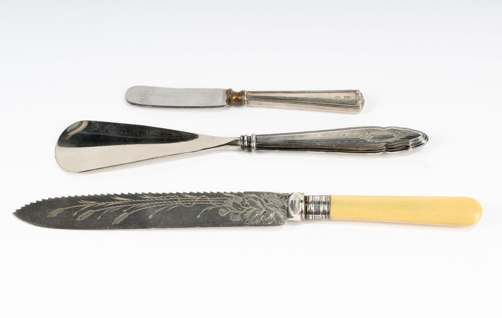 Antique Sterling Silver Knives and Shoehorn: English 19th Century bone handled knife with serrated edge and engraving 10" length, sterling handled shoe horn 8.25", sterling handled butter knife.