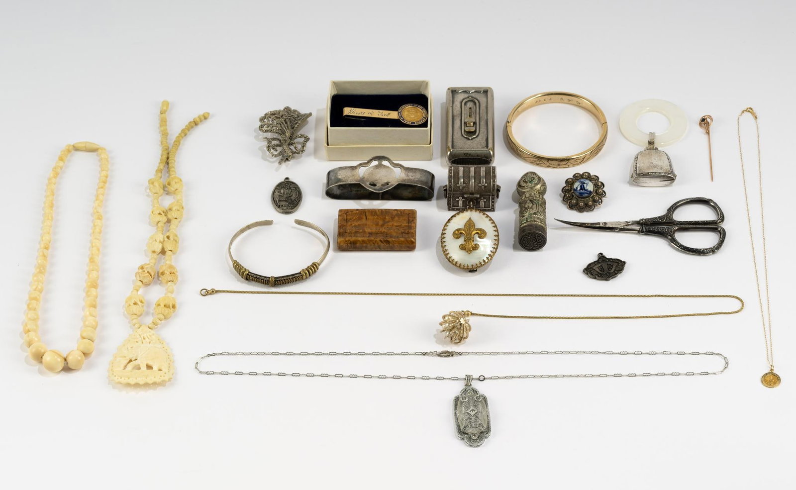 Antique Jewelry and Trinkets incl 14K Gold: 17.5" delicate chain with religious pendant, both 14k 1.2 grams, 10K pin with small sapphire 1.0 grams, sterling silver treasure chest trinket and napkin ring 1.2 troy ounces, sterling silver baby tee