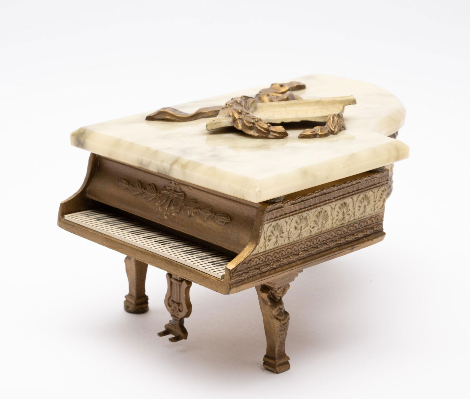 Marble Top Piano Music Box: Working. Marble top with laurel wreath design. 5-3/8" wide x 8-1/2" long x 4" high.