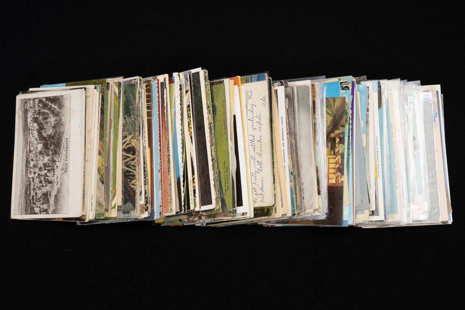 289 Vintage Postcards: Includes 24 people; 44 international; and 221 U.S. Wear consistent with age.
