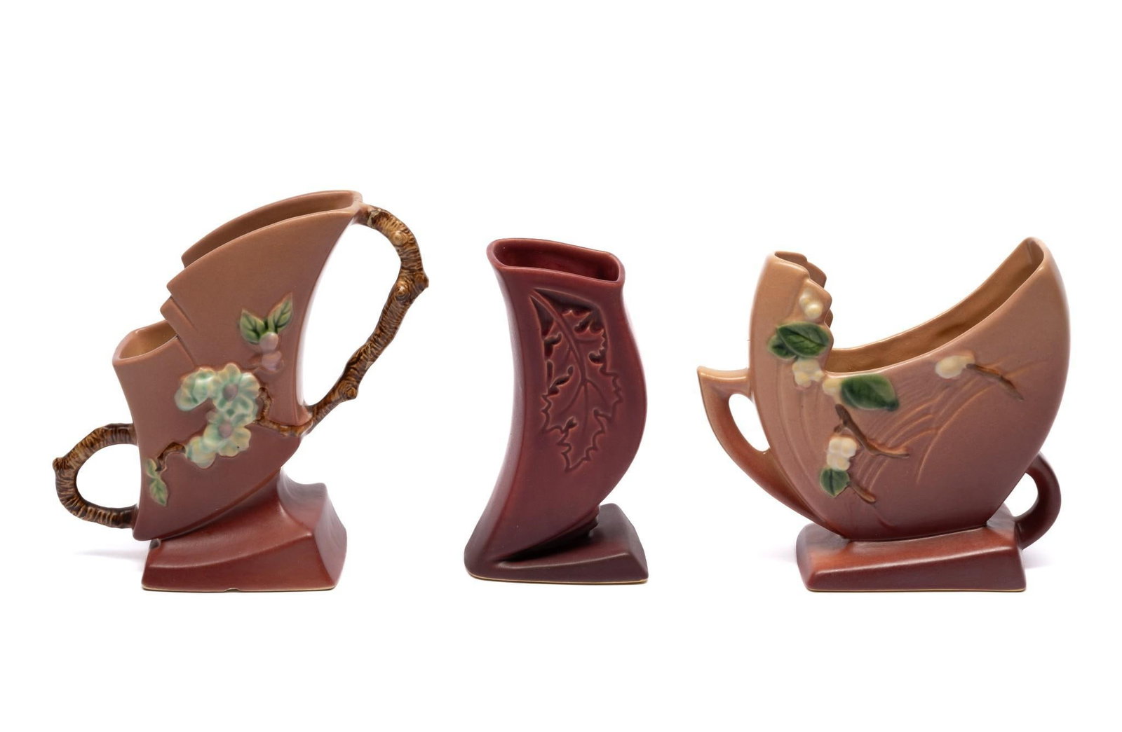3 Roseville Vases: 7" to 6-3/4" wide x 6-1/4" to 7-1/4" high. Crack on one handle.