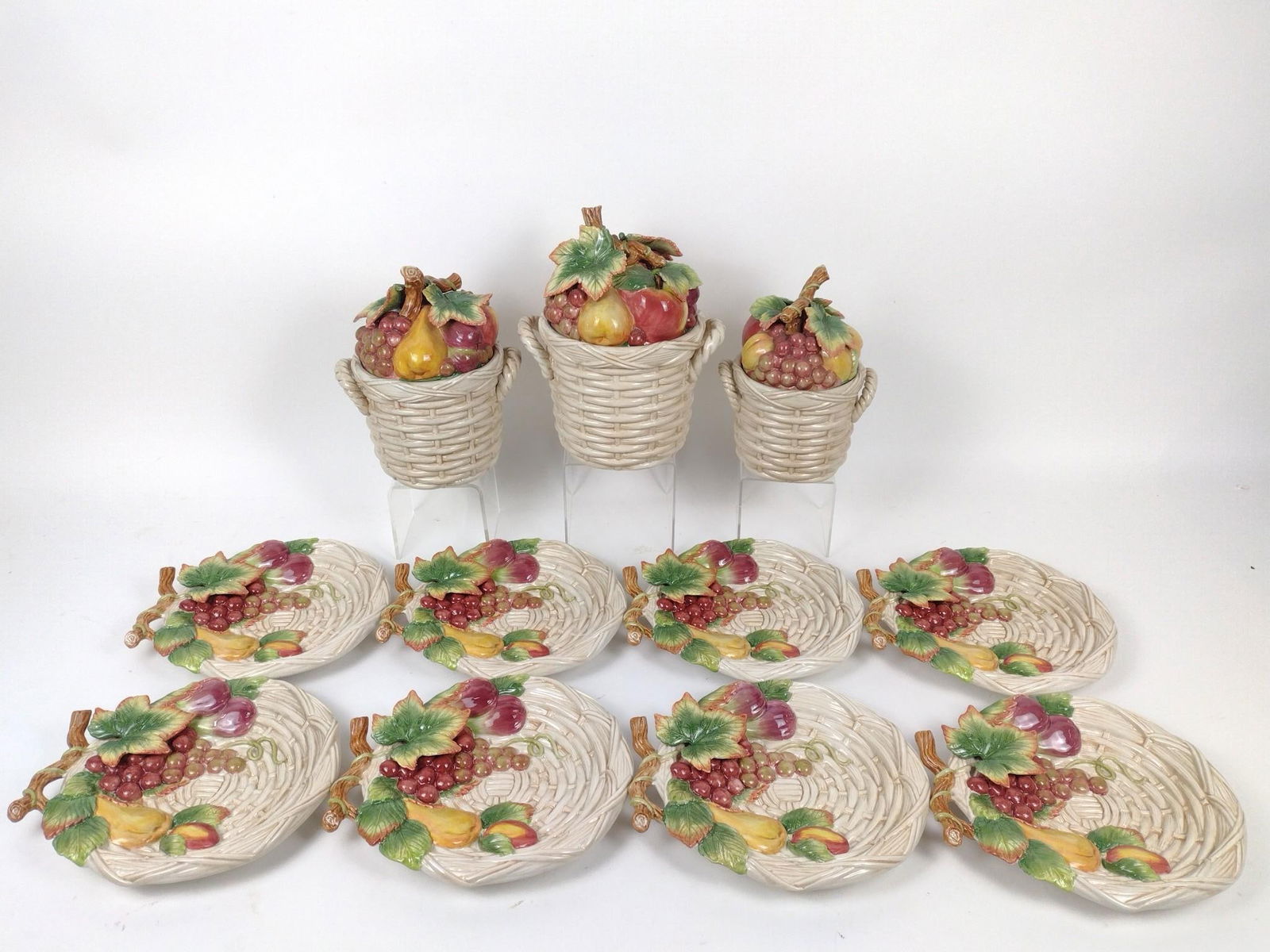11 Fitz and Floyd Fruit Basket Plates and Canisters: 6" to 10-1/2" wide x 1-1/2" to 11" high.