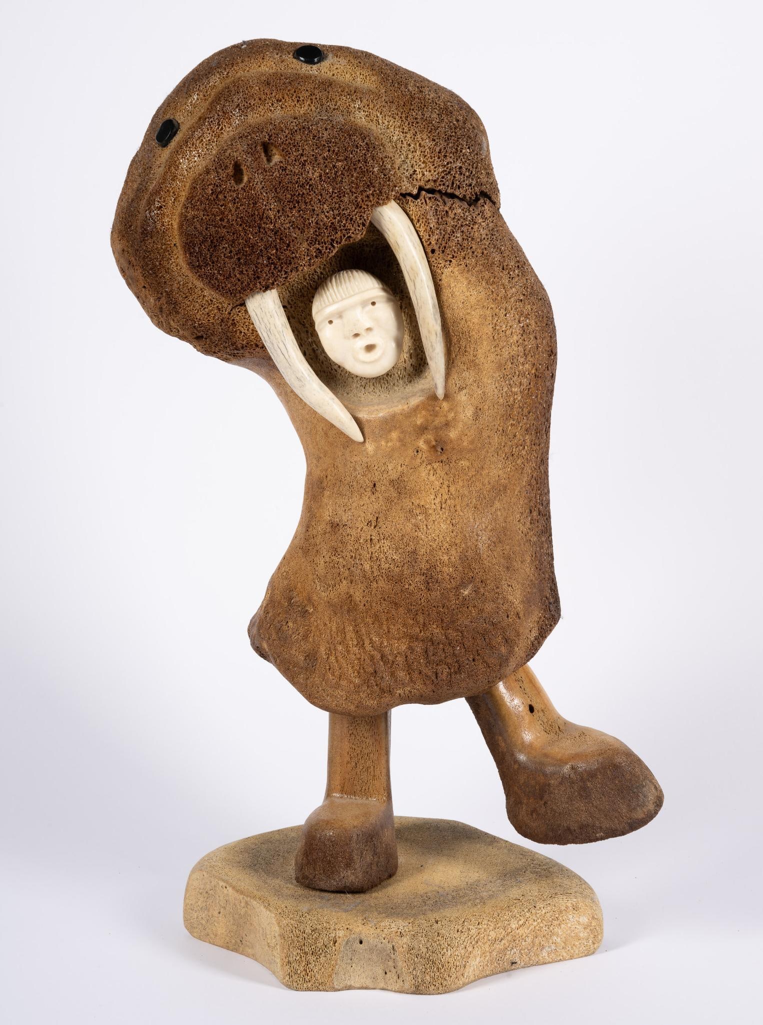 Fossilized Whale Bone Sculpture Douglas William Smith: NOT ELIGIBLE FOR IN-HOUSE SHIPPING. Whale bone and deer antler walrus spirit figure. 22" height. Overall good condition.