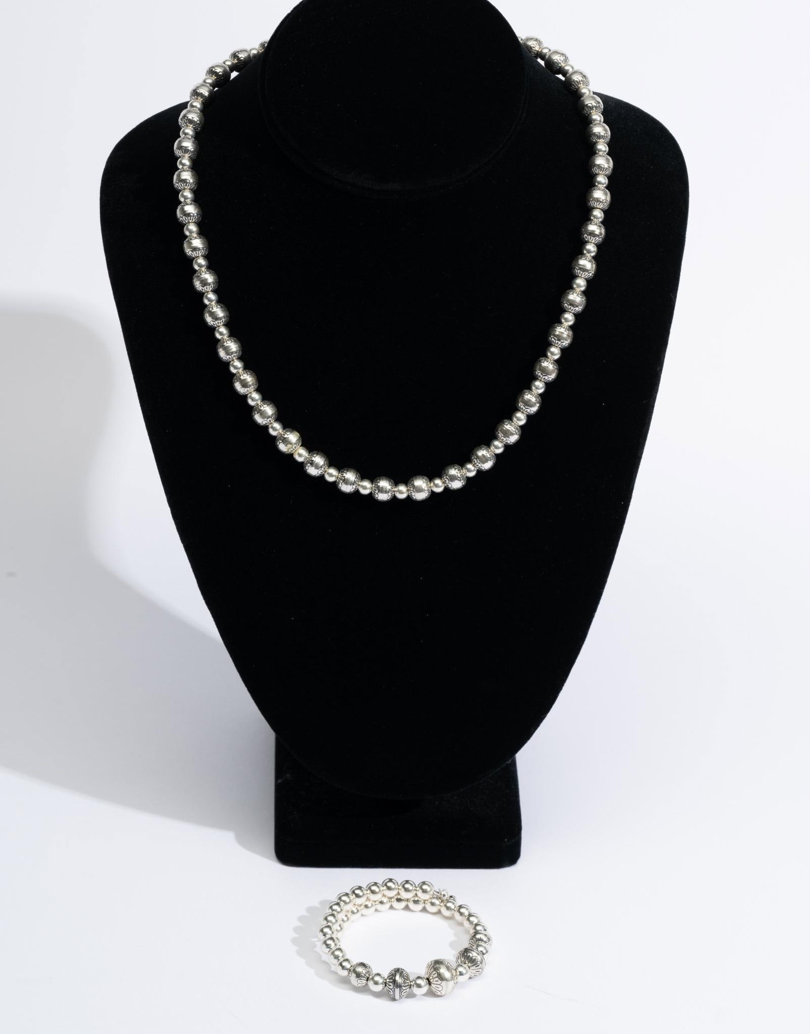 Sterling Silver Necklace & Bracelet: Sterling bead designs with embossed pattern beads matching. Necklace is 21.5" with adjustment to be shorter and bracelet is a spring cuff. Total weight of 1.2 troy ounces.