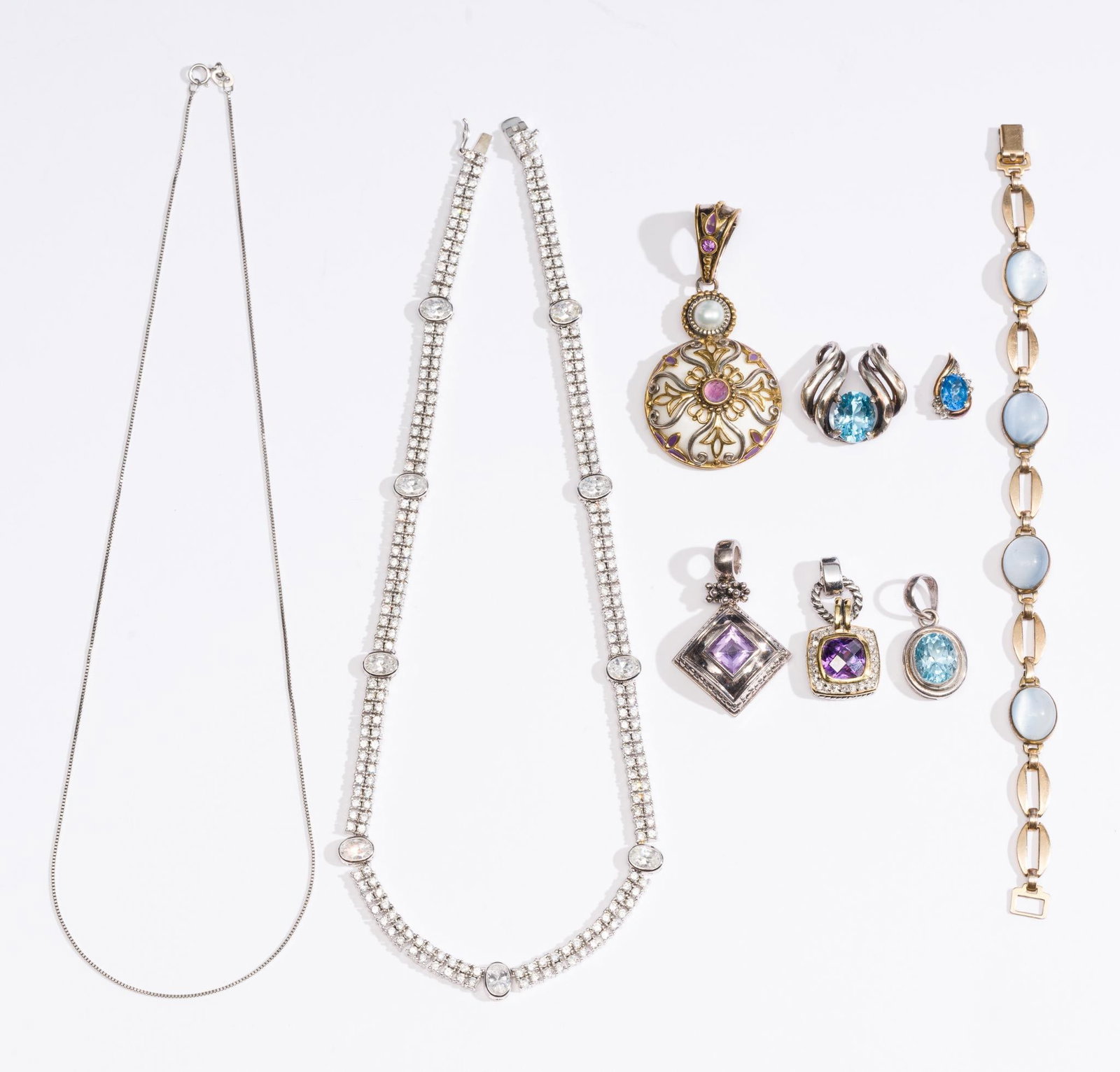 2 Sterling Silver Necklaces and 5 Pendants: One necklace a delicate box chain 18" length and the other a 16" choker with CZ or equivalent gemstones throughout. The pendants have various gemstone enhancements with one being sterling and bronze d
