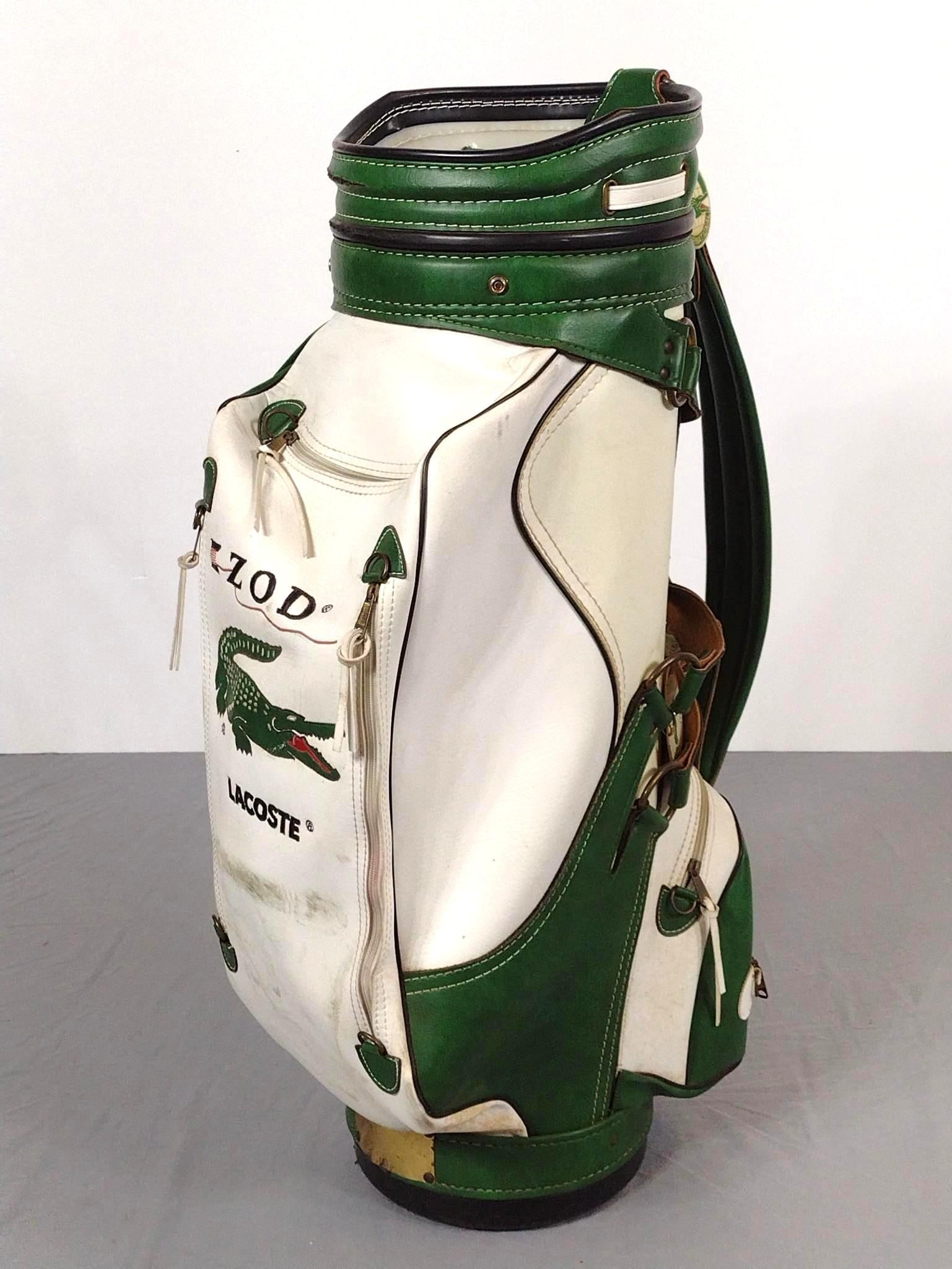 Izod International Leather Golf Bag: NOT ELIGIBLE FOR IN-HOUSE SHIPPING. 20" wide x 36" high. Leather is stiff. Some discoloration and markings consistent with age and use.