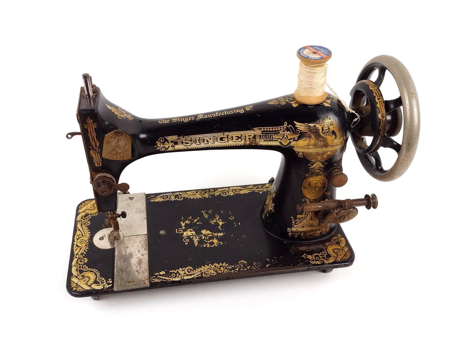 Antique Singer Sewing Machine: Non-powered. 16" wide x 7" deep x 11" high. Some wear and paint losses consistent with age and use.