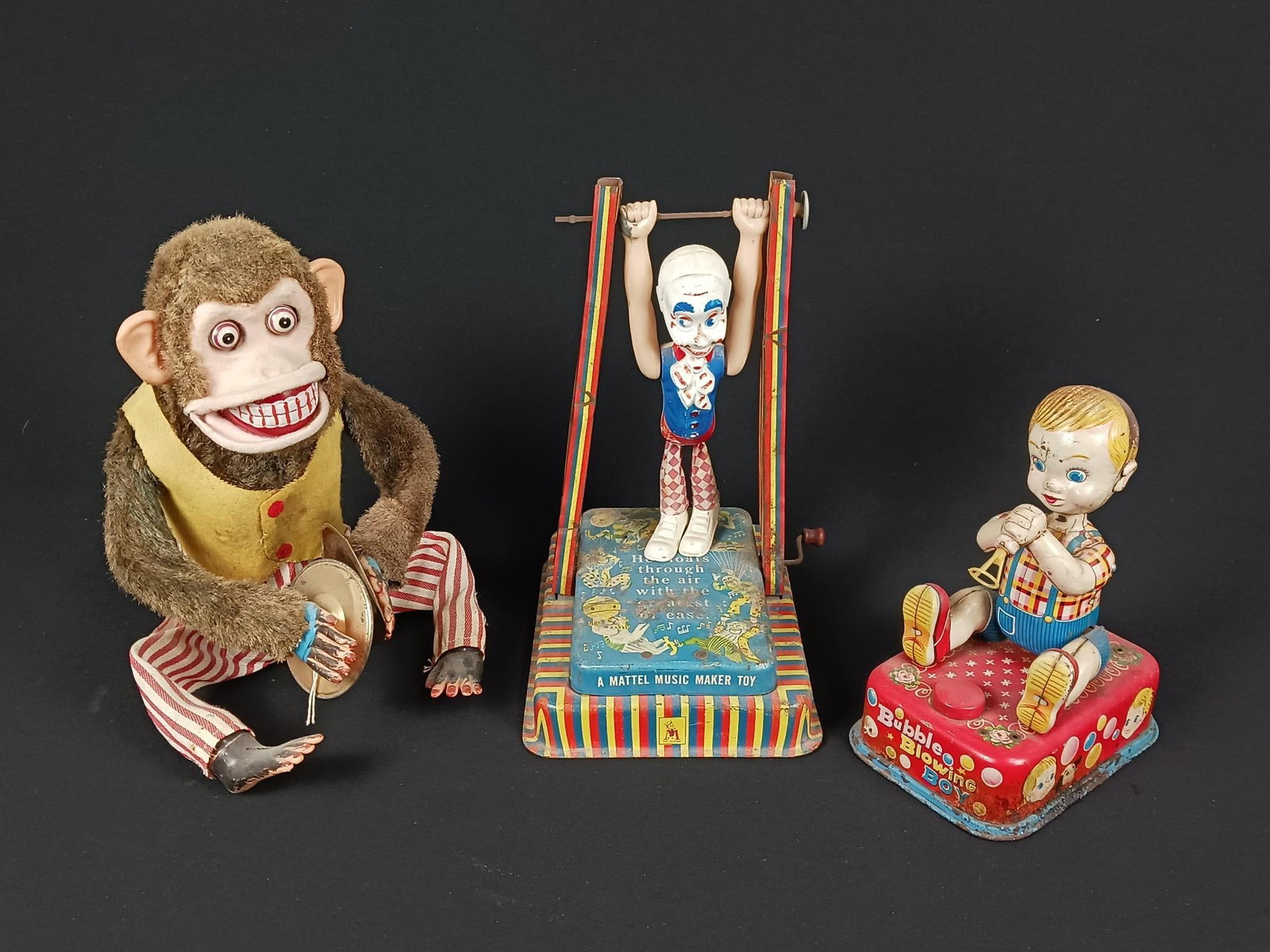 3 Antique Toys incl "Bubble Blowing Boy": 7-1/2" to 11" high. Some paint and finish losses. Some rusting. Toys not working.