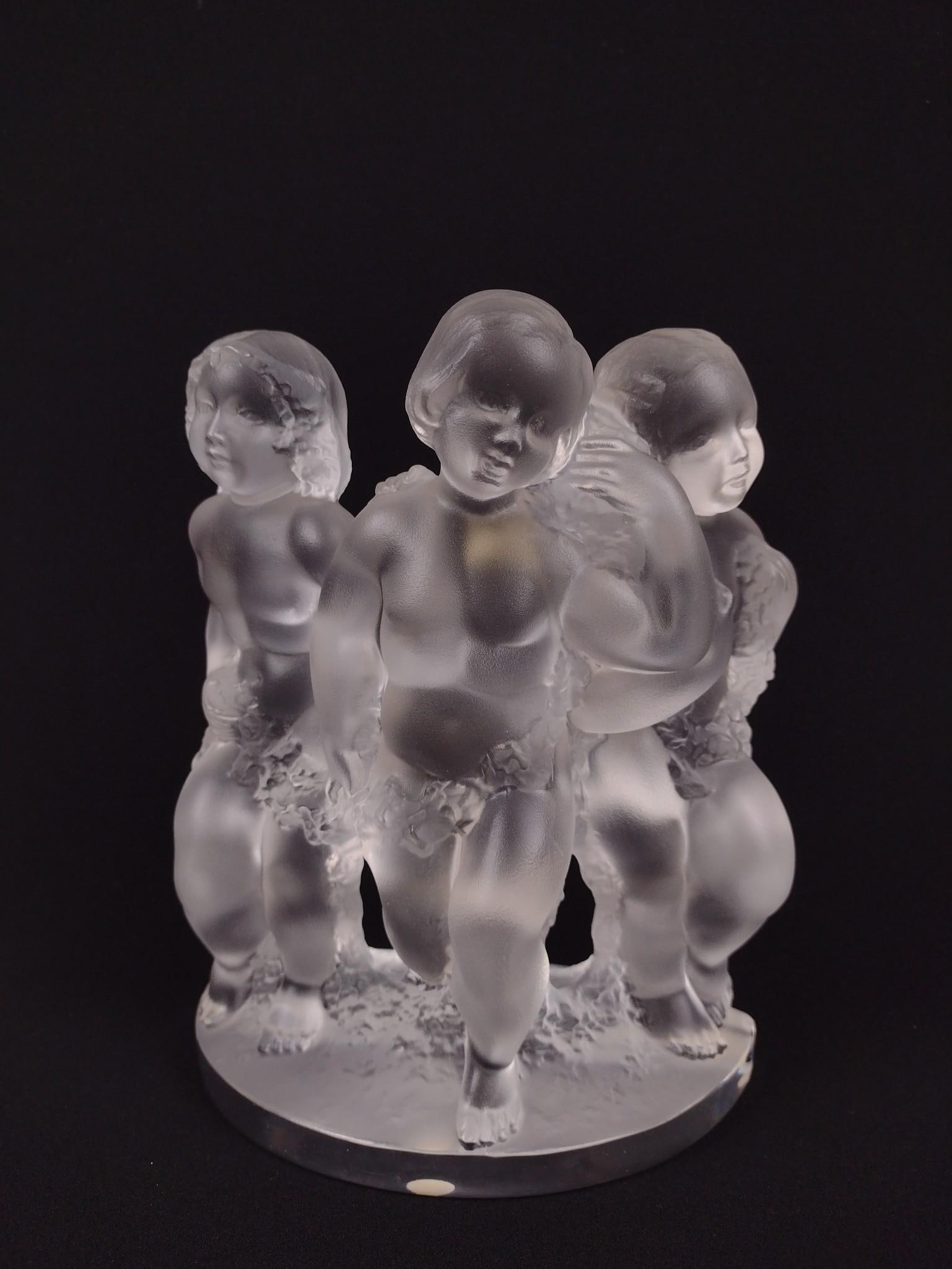 Lalique Figurine of 3 Children: 6-1/2" wide x 3" deep x 8" high. Sticker tag on back.