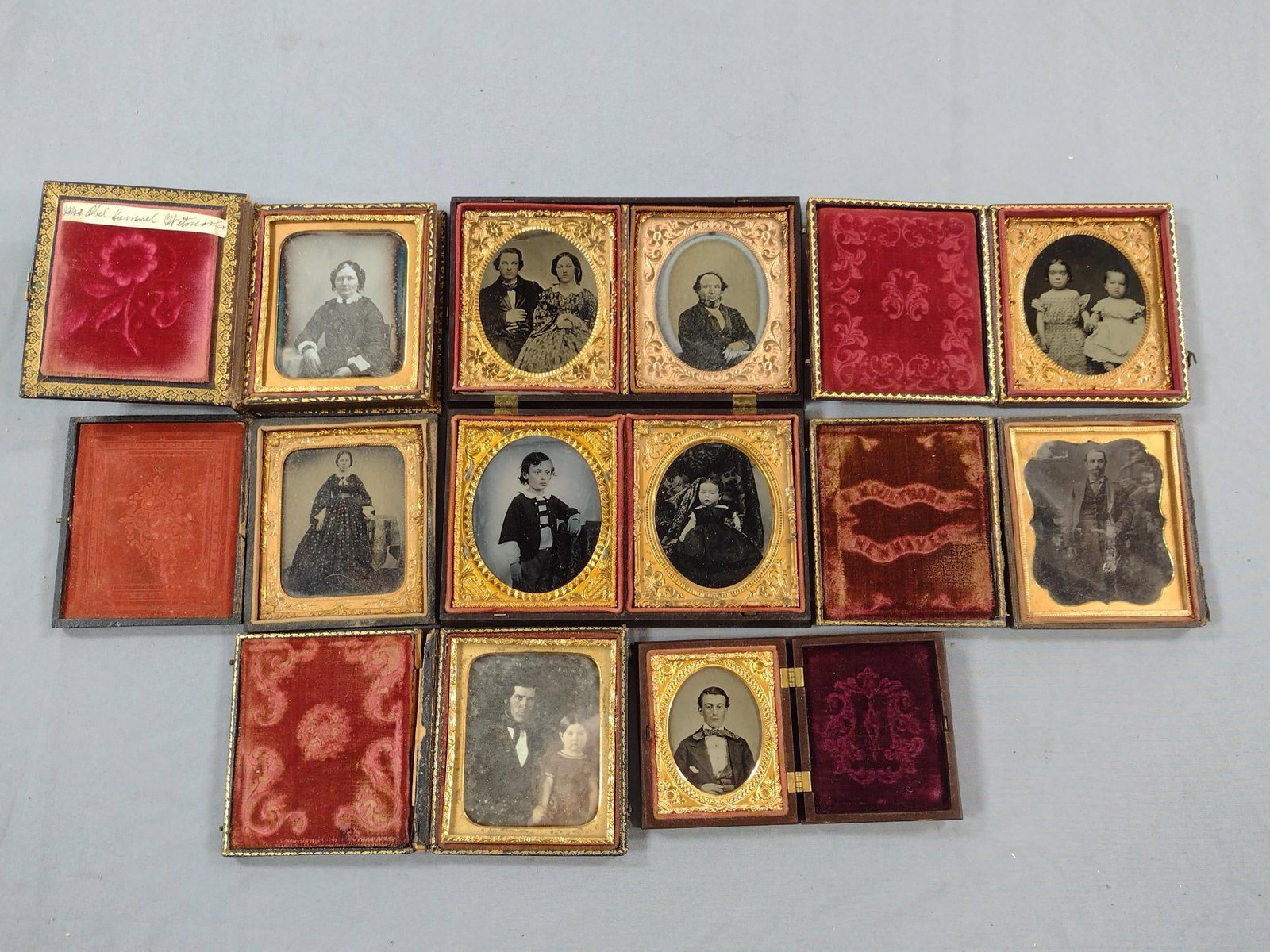 10 Antique Cased Images incl Children: Includes case with 4 images. Cases (closed): 2-3/4" to 4" high x 2-3/4" to 6-1/4" long. Some wear consistent with age and use. One case disconnected at binding.