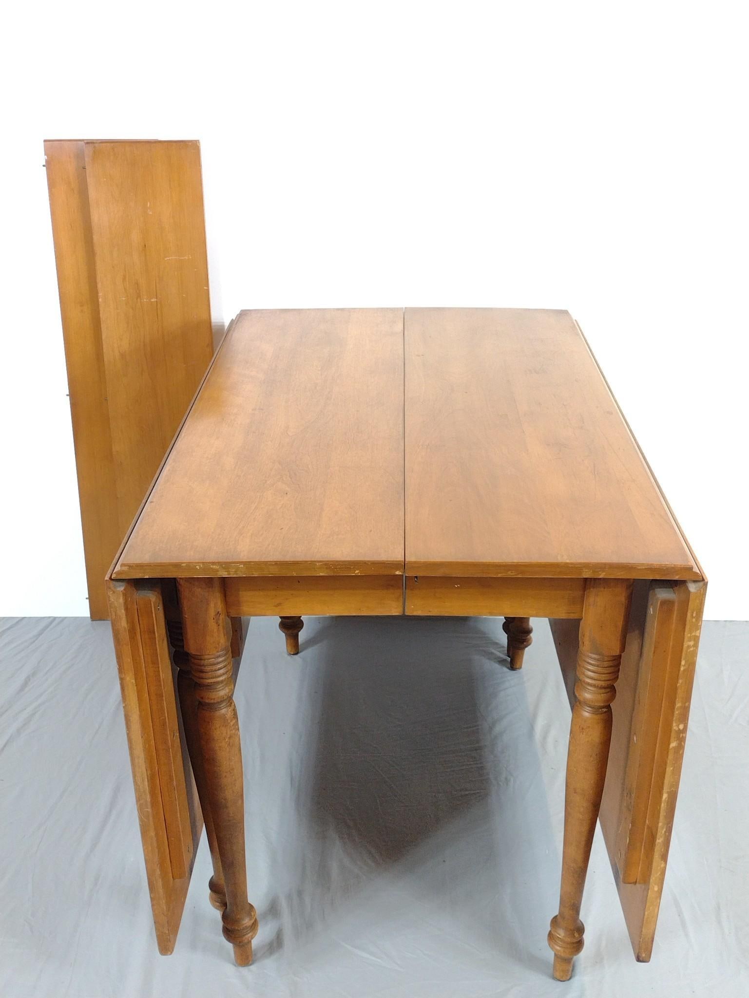 Drop Leaf Dining Table w/ Two Leaves: NOT ELIGIBLE FOR IN-HOUSE SHIPPING. Table open 73", closed 27" wide X 42" deep X 30" high. Leaves 9" wide each. Both Table and leaves have finish loss.