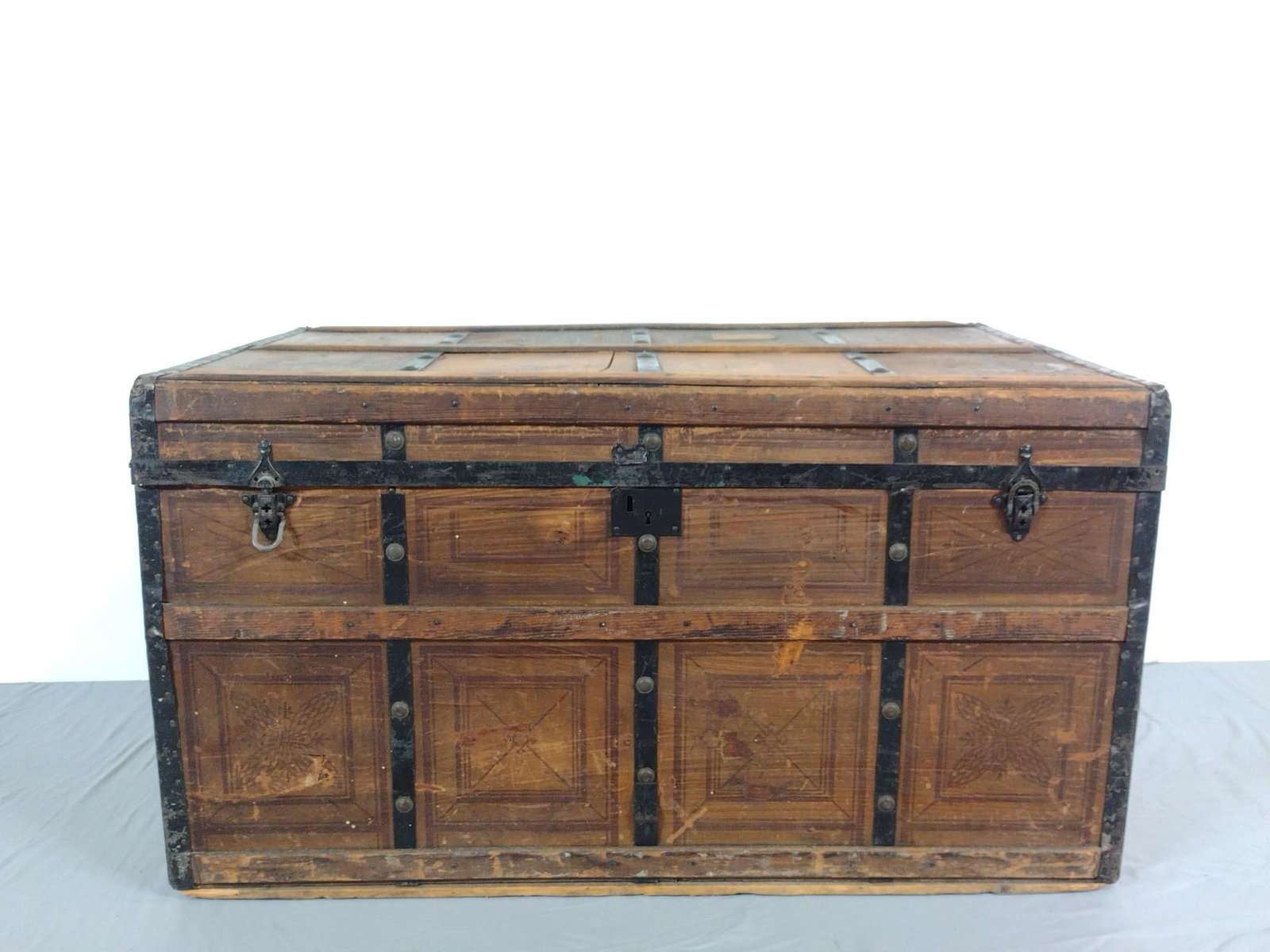 Steamer Trunk: NOT ELIGIBLE FOR IN-HOUSE SHIPPING. 40" wide X 24" deep X 22" high. Has finish loss and discoloring.