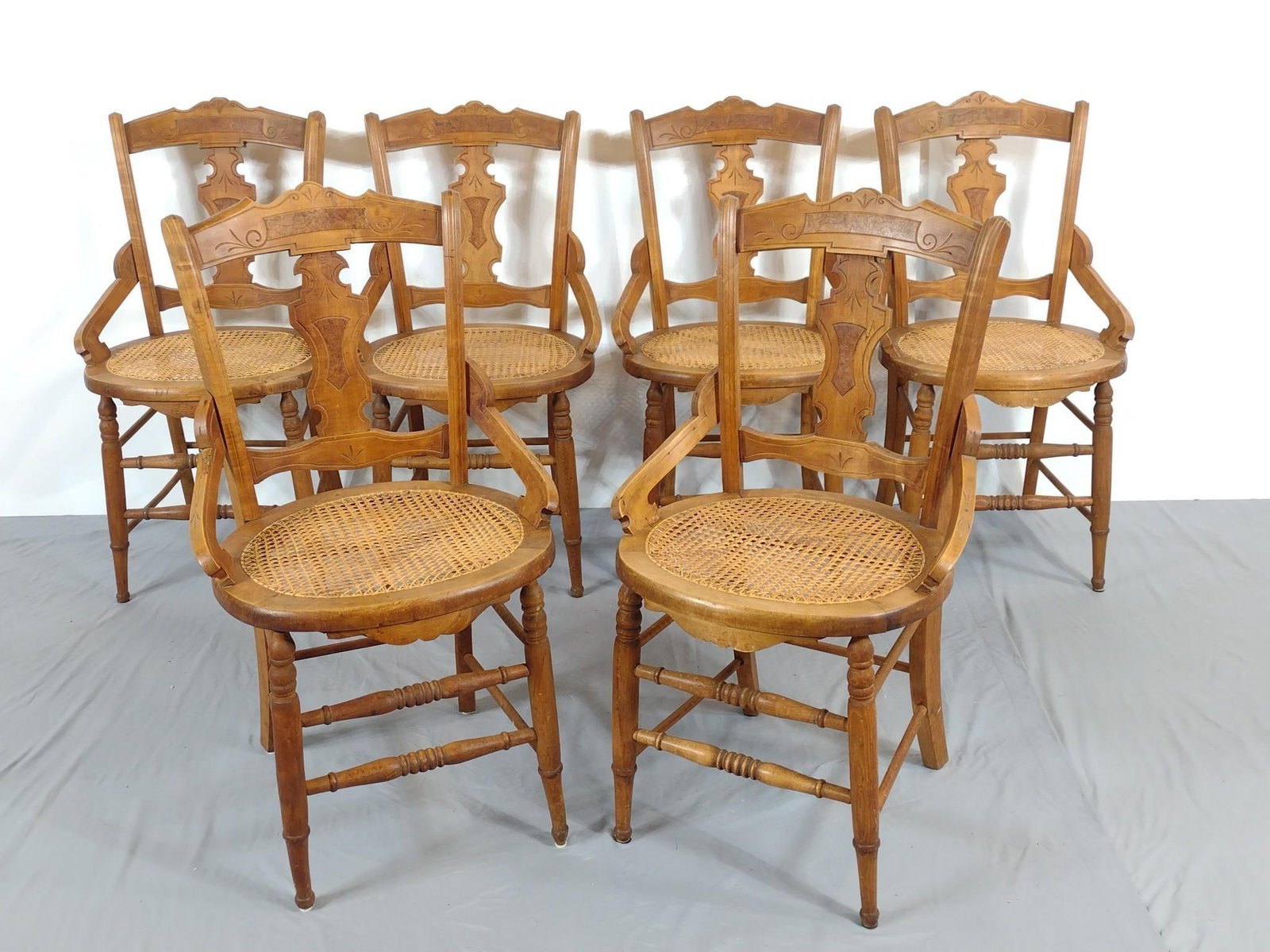 Set of Six Cane Seated Chairs: NOT ELIGIBLE FOR IN-HOUSE SHIPPING. Each 18-3/4" wide X 20-1/2" deep X 34" high. All have some light scratches.