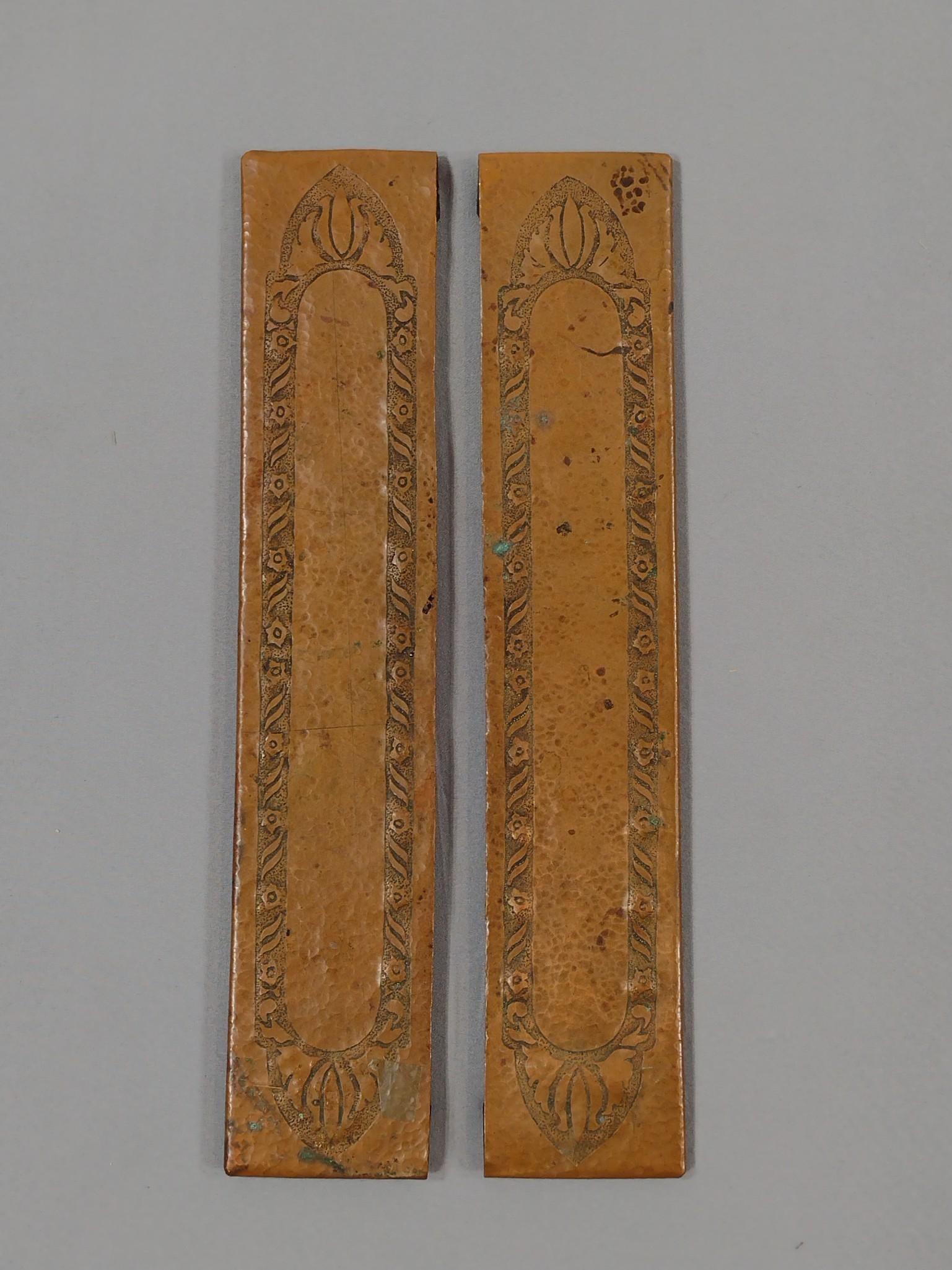 Pair of Copper Arts and Crafts Desk Blotters: Unmarked. Each: 2-3/4" wide x 14" long. Some discoloration and oxidation.