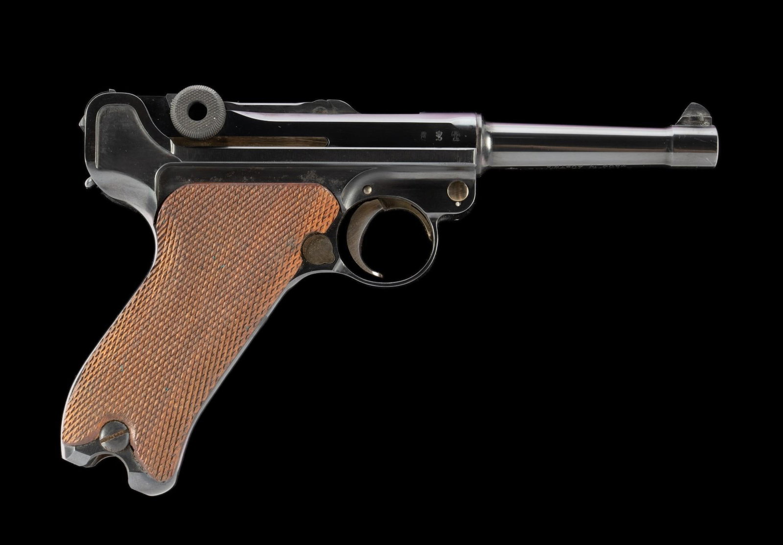 P08 German Luger w/ British Proofs, Caliber 9mm: Serial Number: 6996 Design: Here is a 4" barrel German P08 Luger pistol in caliber 9mm Parabellum. The frame is dated 1911 and the toggle shows the standard "DWM" marking. This piece is uncommon as it
