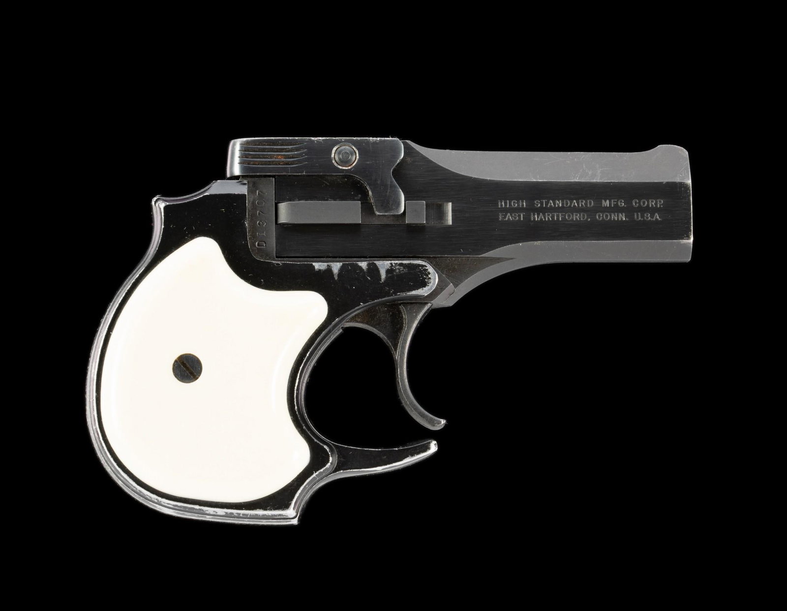 High Standard Derringer (Model DM-101), Caliber.22 Magnum Rimfire: Serial Number: D13707 Design: The High Standard Derringer in .22 Magnum caliber was made from 1969 to 1984. 2-shot, over-under 3 1/2" barrels. Top-break design. Blued with white plastic grips. East Ha