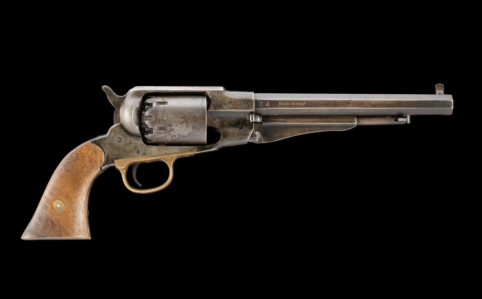 Navy Arms Reproduction of Remington Percussion Revolver, Caliber .44: Serial Number: 063582 Design: This black powder percussion revolver was manufactured circa 1970 in Italy and marketed in U.S.A. by Navy Arms of Ridgefield, NJ, so marked on the 8" octagonal barrel. Ca