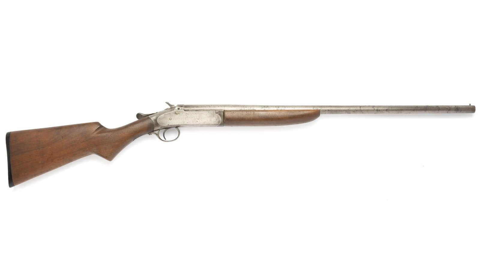 Iver Johnson "Champion" Single Shot Shotgun, 20 Gauge: Serial Number: 40511XI Design: This Iver Johnson "Champion" single shot shotgun is chambered for standard 20 gauge shells and has a 26" barrel marked "20 gauge choke bore barrel and lug forged in one.