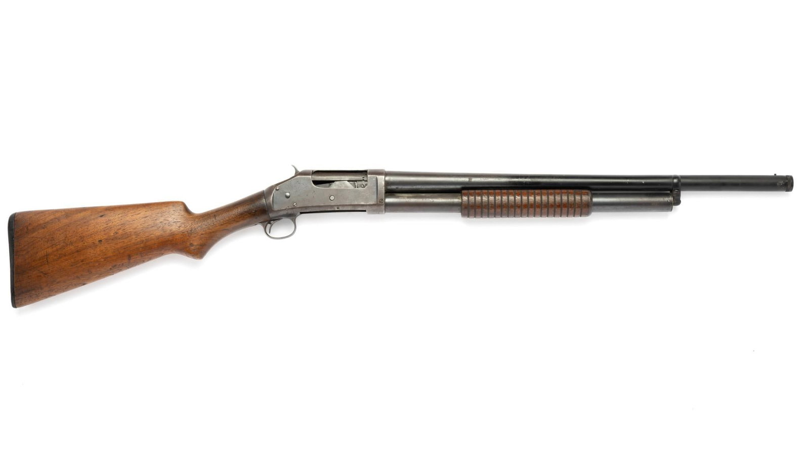 Winchester Model 97 Pump Shotgun, 12 Gauge: Serial Number: E745384 Design: This Winchester Model 97 pump action shotgun has a 22" barrel and is marked "CYL" for cylinder bore; however, the end of the barrel has been threaded internally and a re