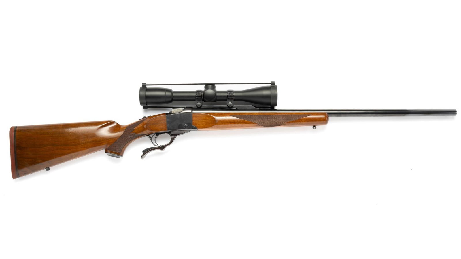 Ruger No. 1 Falling Block Single Shot Rifle w/ Scope, Caliber .30-06: Serial Number: 130-17890 Design: This Ruger No 1 Falling Block single shot rifle was manufactured in 1977. It has a 26" barrel with a factory mounting rail. Caliber is .30-06 Springfield. Both wood an