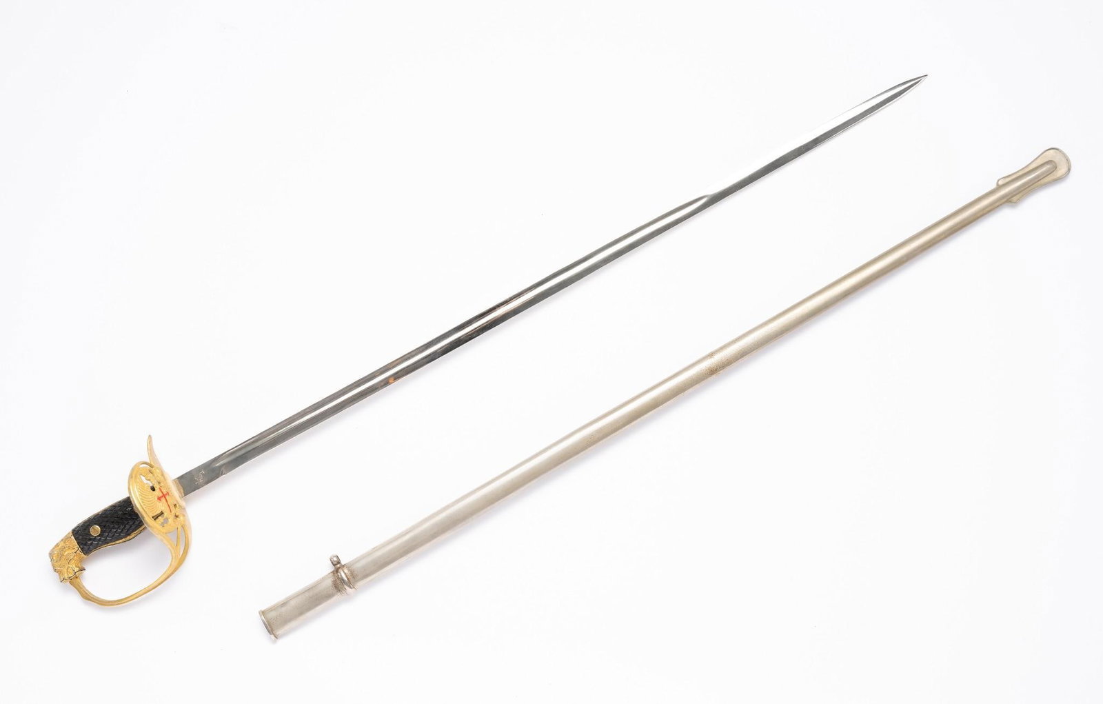Toledo Spanish Lion Head Sword w/ Scabbard: Blade marked "Toledo Spain". Lion head handle. Overall 37-1/4" long. Cracks in the lion head.