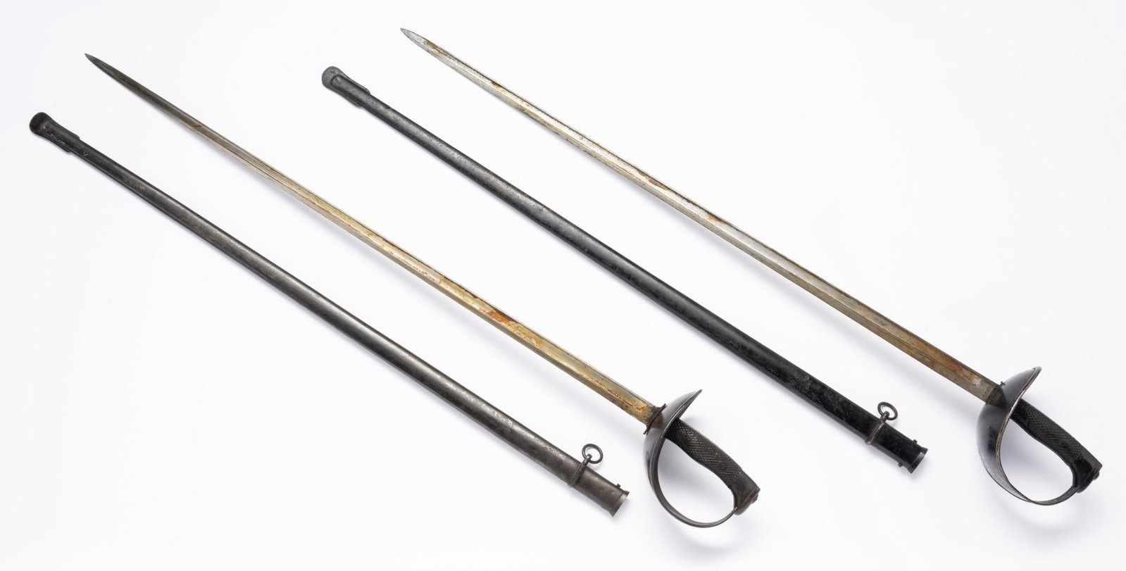 2 Artilleria Nacional Toledo Spanish Swords: Both with scabbard. Both marked on hilt. Both overall 42-3/4" long.