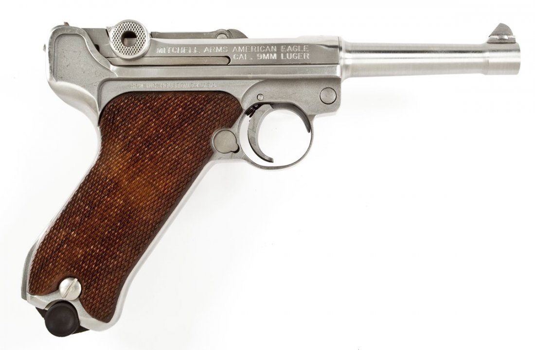Mitchell Arms American Eagle P-08 Pistol - 9mm: SERIAL #: 7264 DESIGN: Semi-automatic with one magazine. 4" barrel. MATERIAL/FINISH COMPOSITION: Stainless steel. Checkered wood grip panels. FEATURES: Blade front sight. V-notch rear sight. The top f