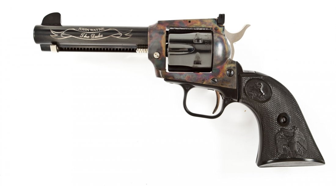 Colt 1984 John Wayne "Duke" Frontier - .22 Cal.: SERIAL #: G203155 DATE OF MANF: 1982 (1 of 5,000) DESIGN: Single action with removable 6-shot cylinder. 4-3/4" barrel. MATERIAL/FINISH COMPOSITION: Blued steel barrel, cylinder, trigger guard and uppe