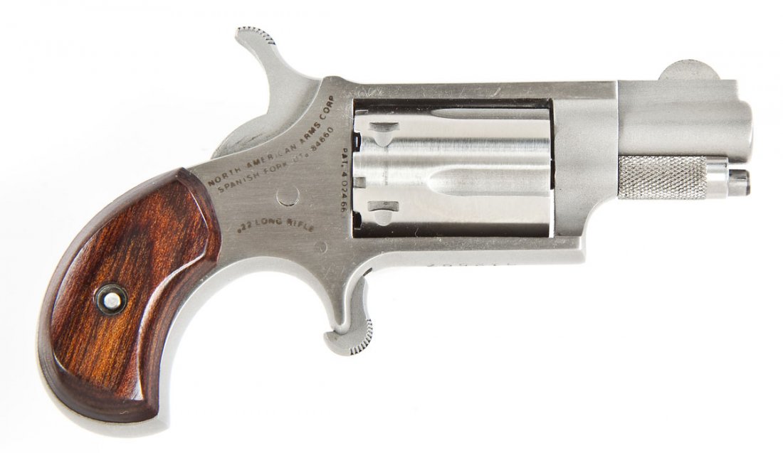 North American Arms Mini Revolver - .22 LR: SERIAL #: G12567 DESIGN: Single action with 5-shot removable cylinder. 1-1/8" barrel. MATERIAL/FINISH COMPOSITION: Stainless steel. Laminated rosewood grip panels. FEATURES: Blade front sight. Serrate