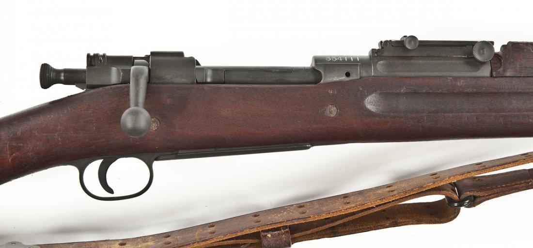 Springfield Armory Model 1903 Rifle - .30-06 Cal.: SERIAL #: 554111 DESIGN: Bolt action with internal magazine. 24" barrel. MATERIAL/FINISH COMPOSITION: Blued steel. Full length military wood stock. FEATURES: Blade front sight. Rear ladder sight. Chec