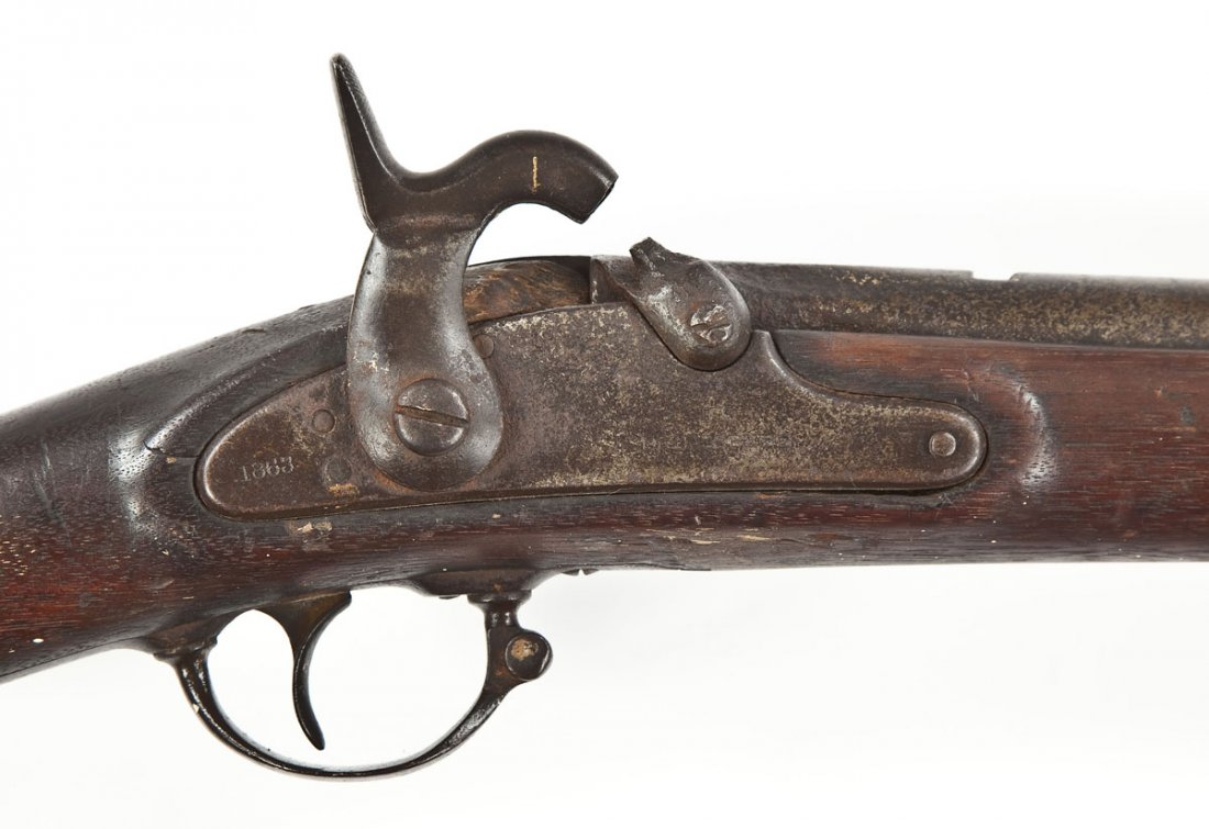 US Springfield Model 1863 - .58 Cal.: SERIAL #: None DESIGN: Percussion operated muzzle loader . 40" barrel. MATERIAL/FINISH COMPOSITION: Blued steel. Military wood stock. Steel butt plate. FEATURES: "1863" stamped on rear of lock plate. 