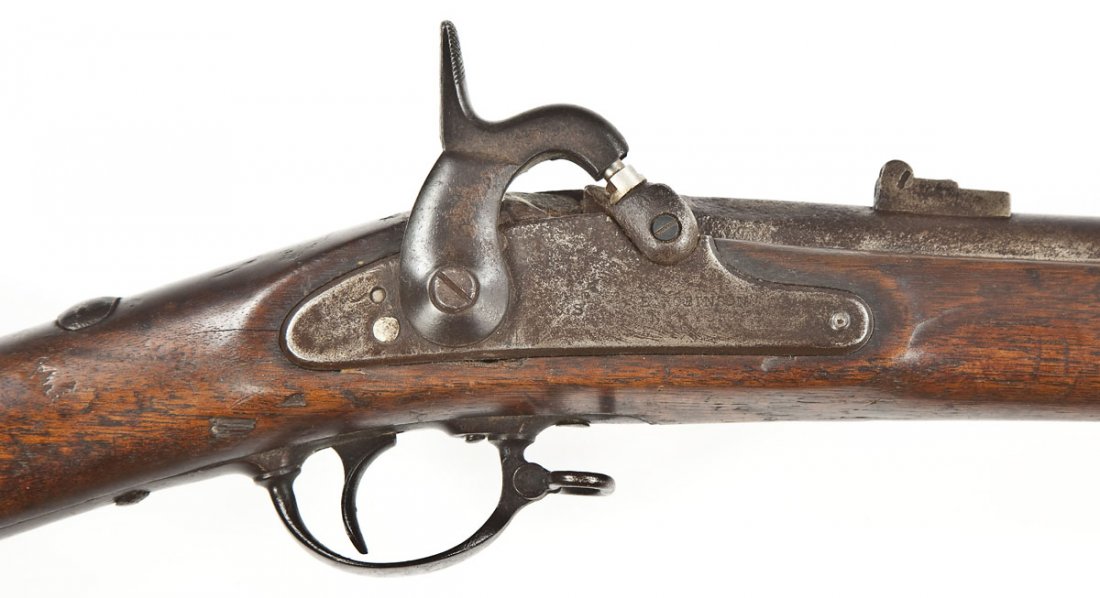 US Springfield Model 1863 - .58 Cal.: SERIAL #: None DESIGN: Percussion operated muzzle loader . 40" barrel. MATERIAL/FINISH COMPOSITION: Blued steel. Military wood stock. Steel butt plate. FEATURES: "1863" stamped on rear of lock plate. 