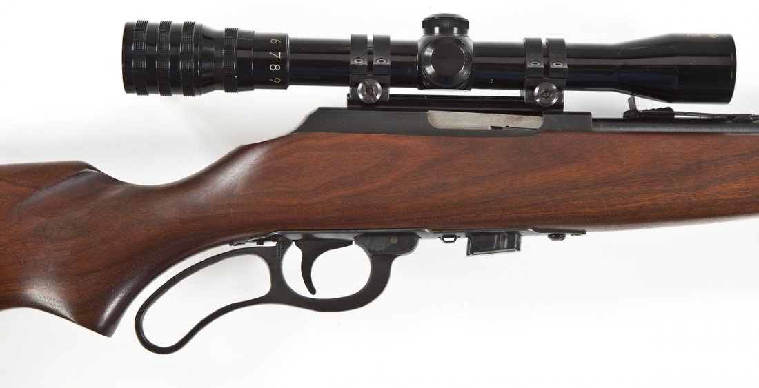 Marlin Model 56 Rifle - .22 Cal.: SERIAL #: None DESIGN: Lever action with detachable magazine. 22" barrel. MATERIAL/FINISH COMPOSITION: Blued steel. Wood pistol grip stock. FEATURES: Blade front sight. Adjustable rear sight. All-Pro 