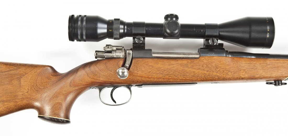 FN Mauser Rifle - 8mm Mauser Cal.: SERIAL #: 2508 DESIGN: Belgian made bolt action with internal magazine. 17" barrel. MATERIAL/FINISH COMPOSITION: Blued steel except for the bolt. Wood Monte Carlo stock. FEATURES: No sights. Simmons 3
