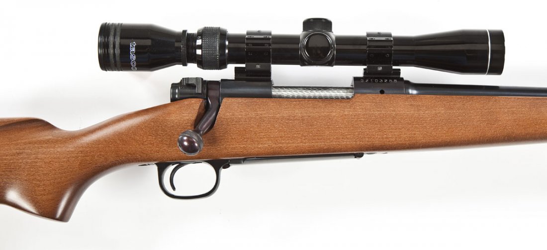 Winchester Model 70 Rifle - .243 Cal.: SERIAL #: G2103288 DESIGN: Bolt action with internal magazine. 22" barrel. MATERIAL/FINISH COMPOSITION: Blued steel. Wood pistol grip stock. FEATURES: Hooded blade front sight. Rear sight removed. Tas