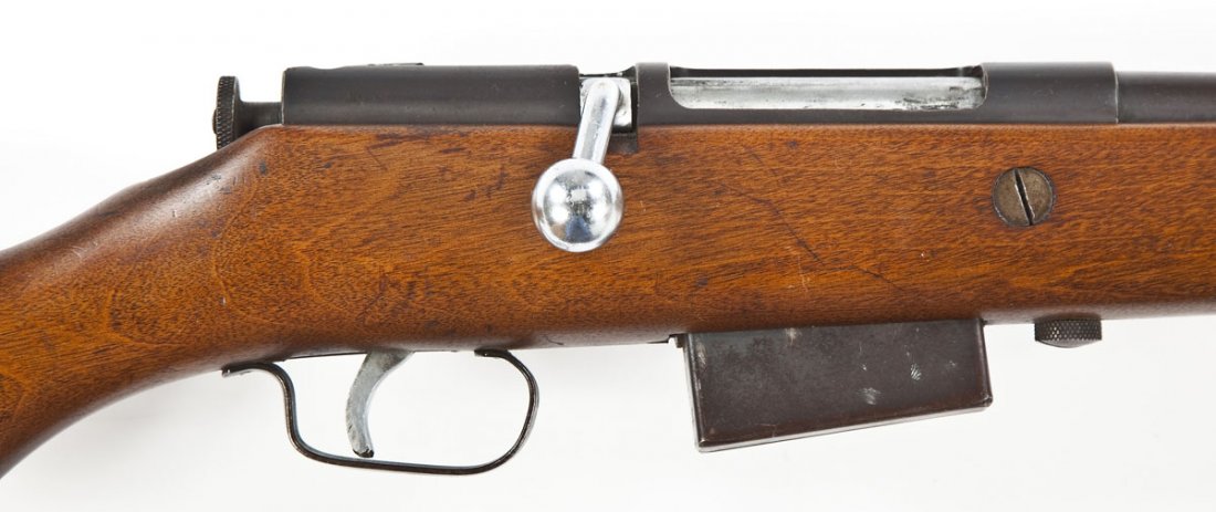 Mossberg Model 85 Shotgun - 20 Ga.: SERIAL #: None DESIGN: Bolt action with internal magazine. 26" full choked barrel. Chambered for 2-3/4" shells. MATERIAL/FINISH COMPOSITION: Blued steel except for the bolt. Wood pistol grip stock. FE