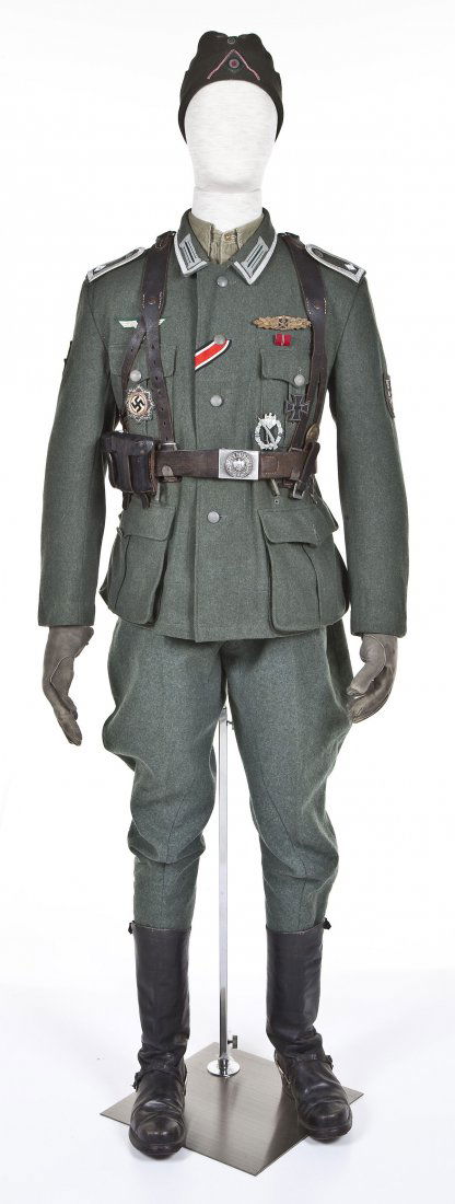 WWII German Battle Uniform Including Mannequin: DESCRIPTION: World War II German battle uniform. Includes side cap, long sleeve pull over under shirt, NCO combat tunic, combat gloves, pants with suspenders, marching boots with Hobnail NCO rank, lea