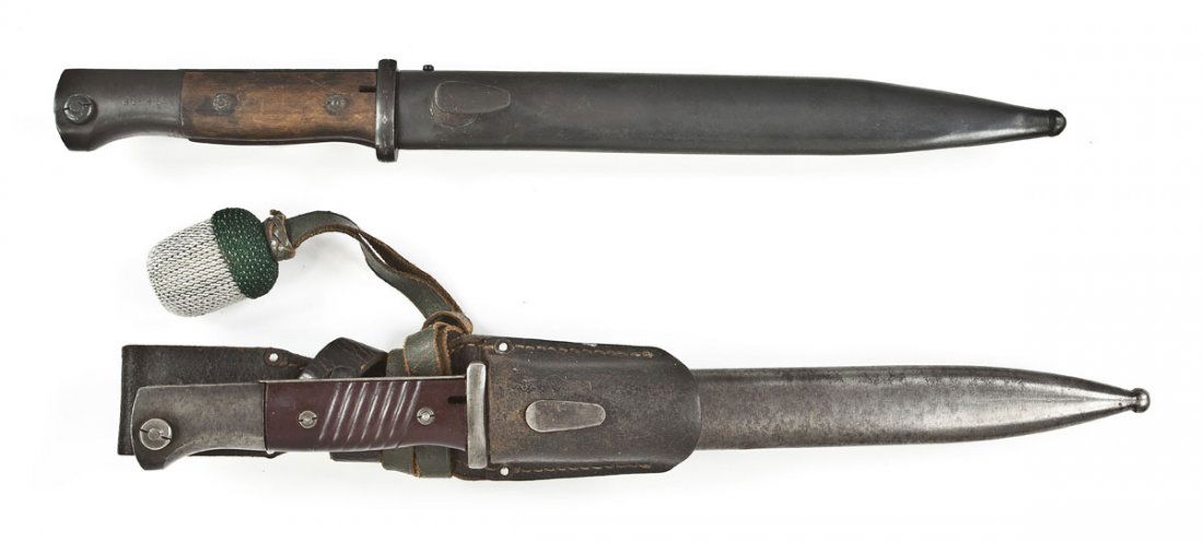 2 K98 Mauser 1943 Bayonets with Scabbards: DESCRIPTION: Two K98 bayonets. Includes: 1) Bayonet with matching scabbard. Leather hanger marked "KVZ" over "1942". Includes NCO knot. Base of left side marked "43 CRS". 2) Bayonet with non-matching