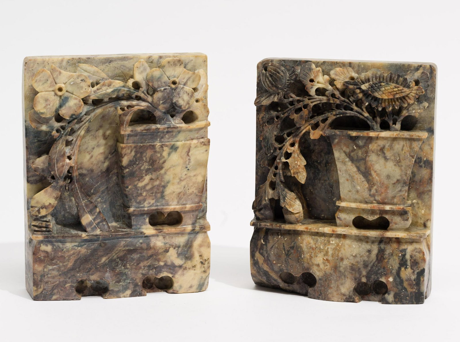 2 Carved Soapstone Blocks: DESCRIPTION: Each carved with vase full of flowers sitting on a pedestal. MEASUREMENT: 4" wide x 5-1/8" long.