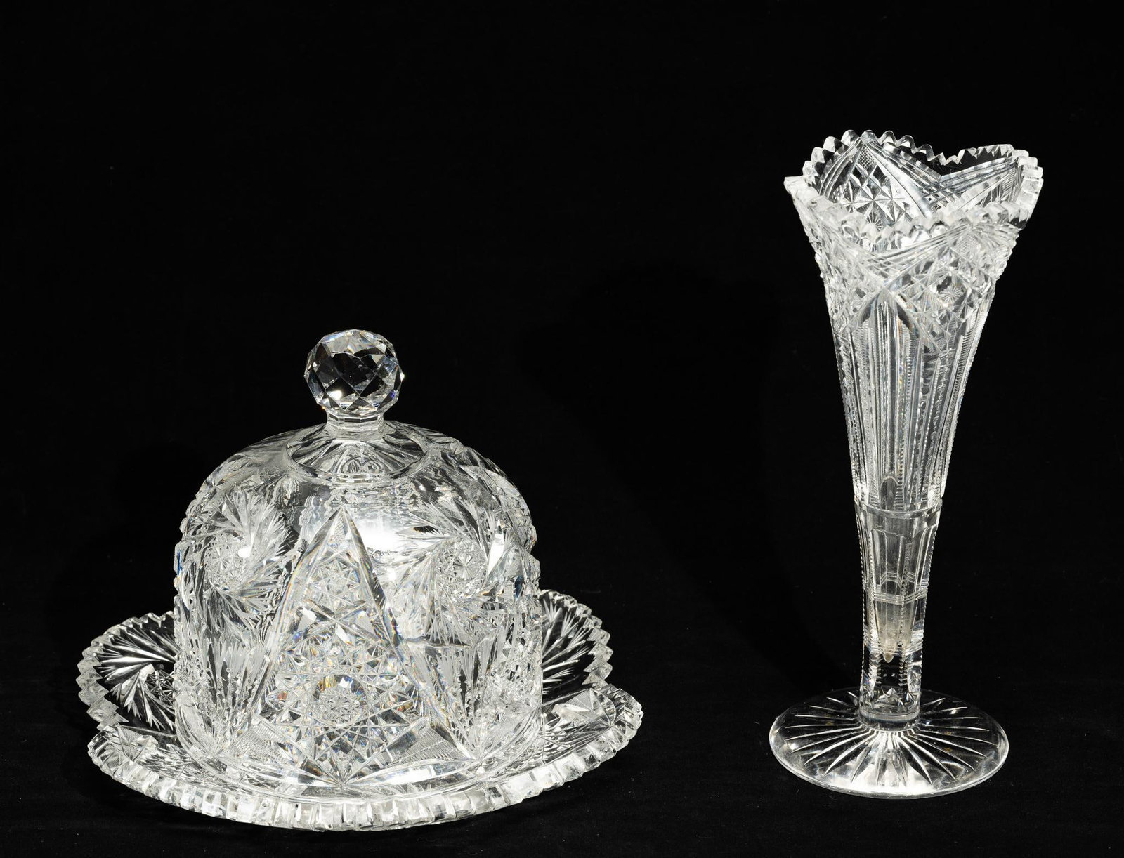 American Brilliant Cut Glass Vase & Butter Dome: DESCRIPTION: Brilliant cut glass vase, unmarked. Brilliant cut glass butter dome, unmarked. MEASUREMENT: Vase 4" diameter x 9-7/8" high. Butter dome 9-1/2" wide x 6" high. CONDITION: Light scratching 