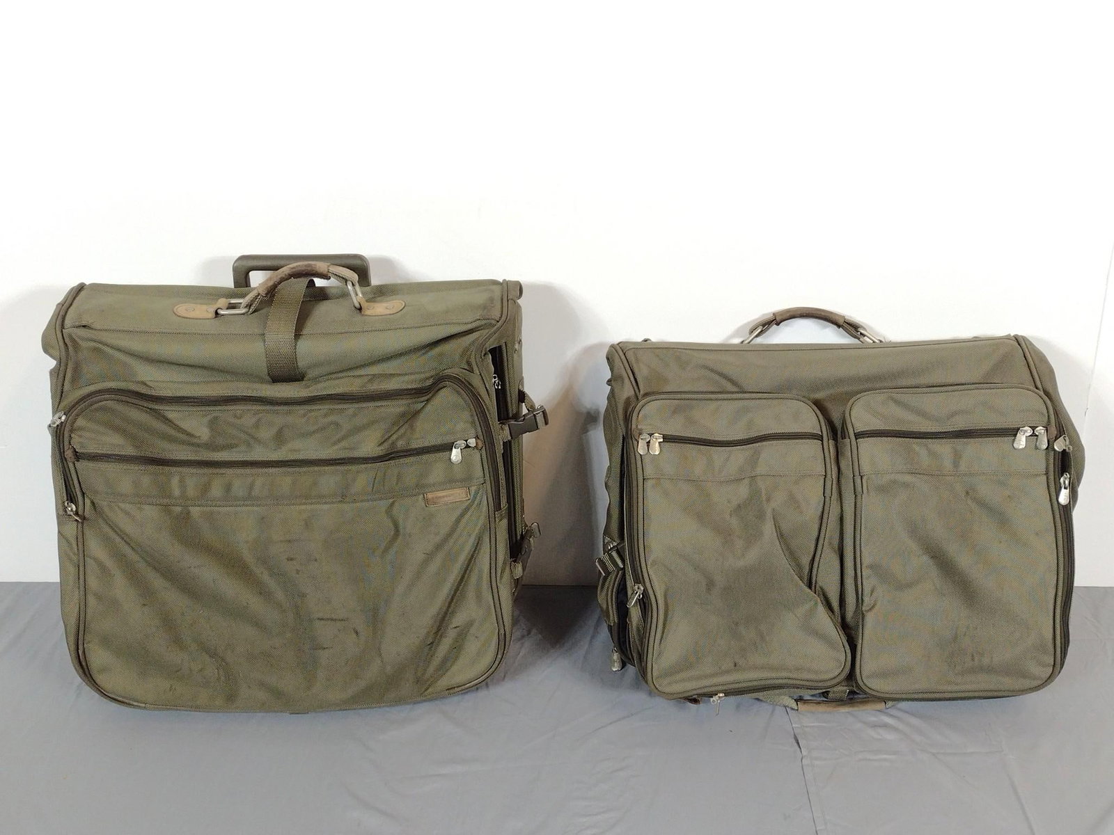 2 Pcs Briggs & Riley Luggage: NOT ELIGIBLE FOR IN-HOUSE SHIPPING. 23" wide X 9" deep X 19" high. Both have some wear.