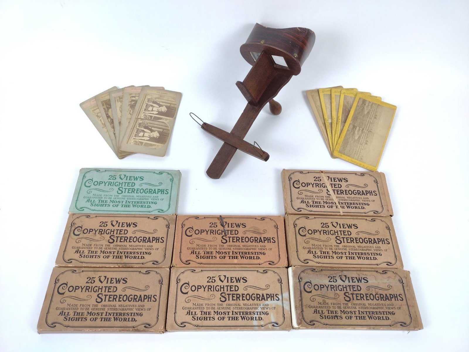 Stereoviewer with 9 Sets of Cards: Cards include Dawson City, Rome, Wonders of the Old World, and more. Some wear consistent with age and use.