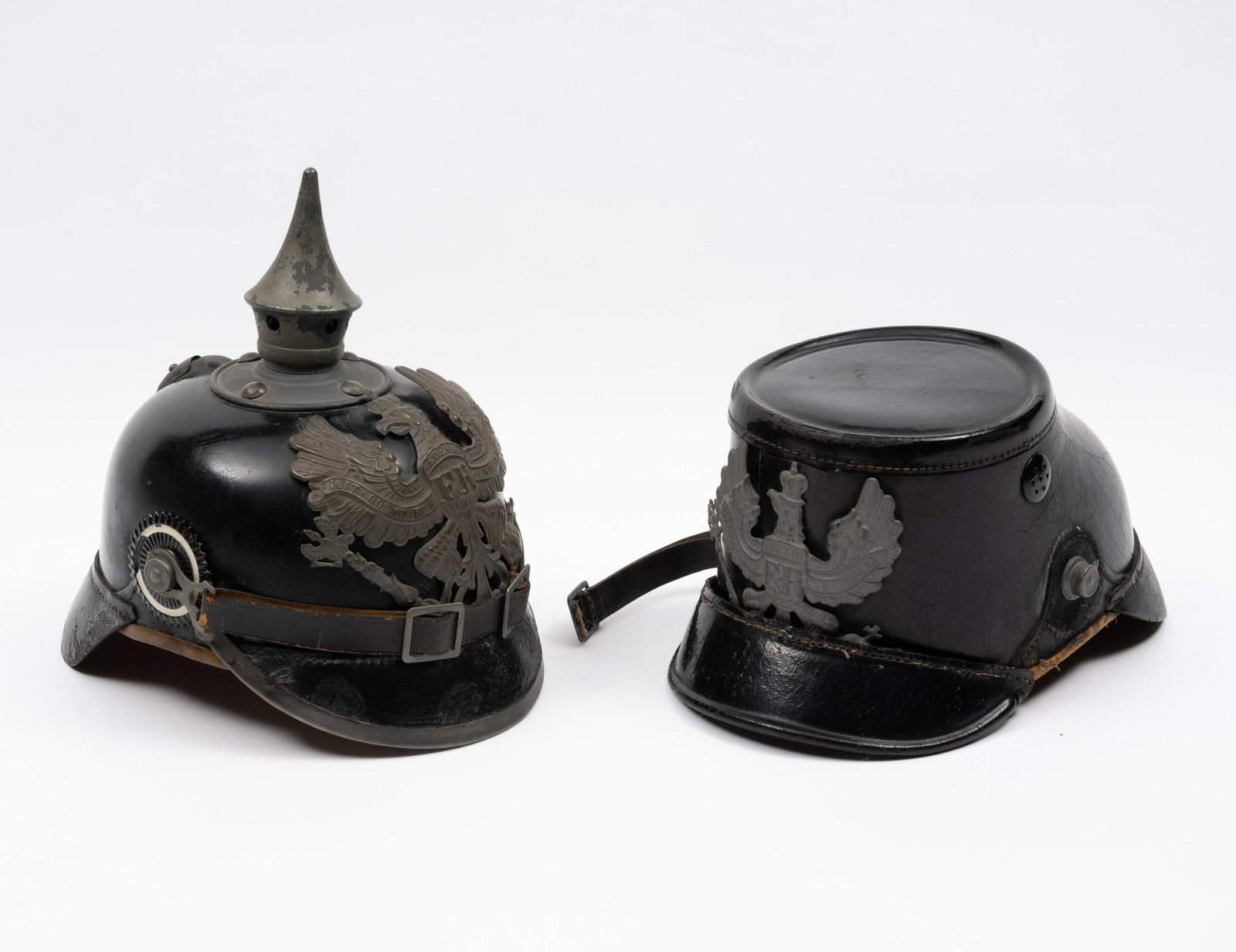 1876 Mechanicsburg Singer Band Helmet and Hat: 9" long x 6" to 9" high. Provenance: Helmets worn for 100th anniversary celebration in Philadelphia for the founding of the United States. Point top made in Dresden. Flat top hat with detached visor. 