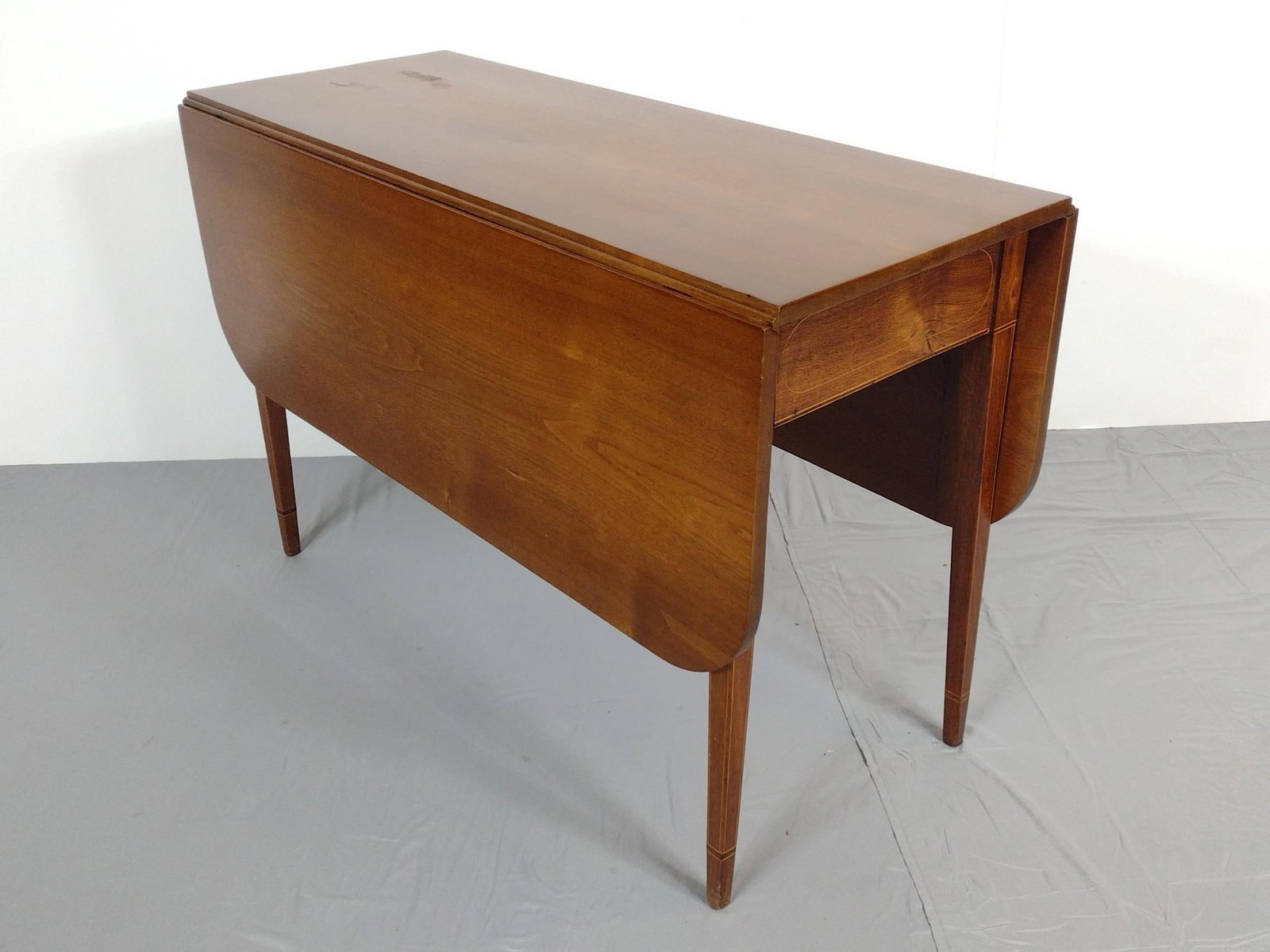 Drop Leaf Dining Table: NOT ELIGIBLE FOR IN-HOUSE SHIPPING. Open 50-1/2", closed 18-3/4" wide X 45-1/2" deep X 29-1/2" high. Has some scratches.