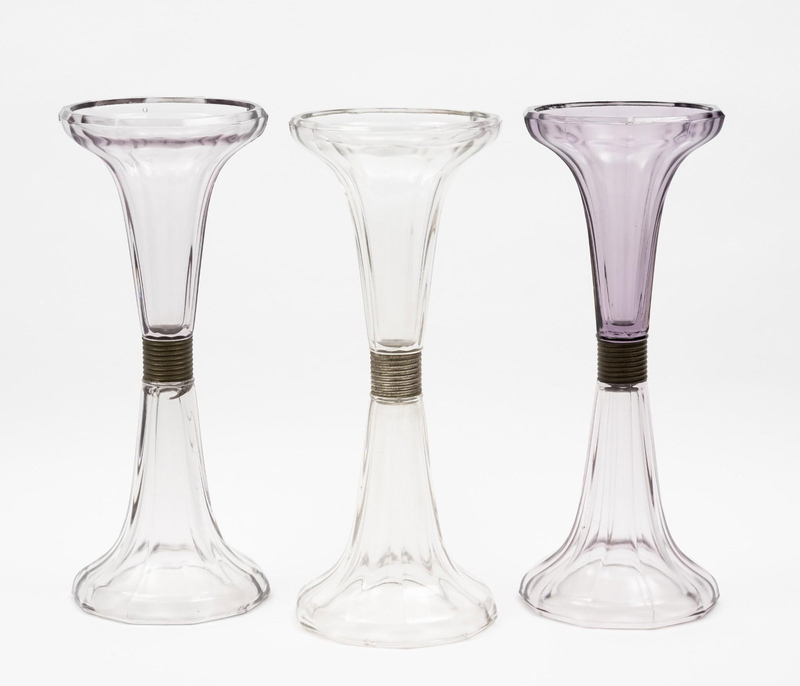 3 Soda Fountain Risers: Two with clear and amethyst glass. Each 5" diameter x 12-1/2" high. Some roughness to edges of glass. One clear and amethyst riser with imperfection at connecting point.