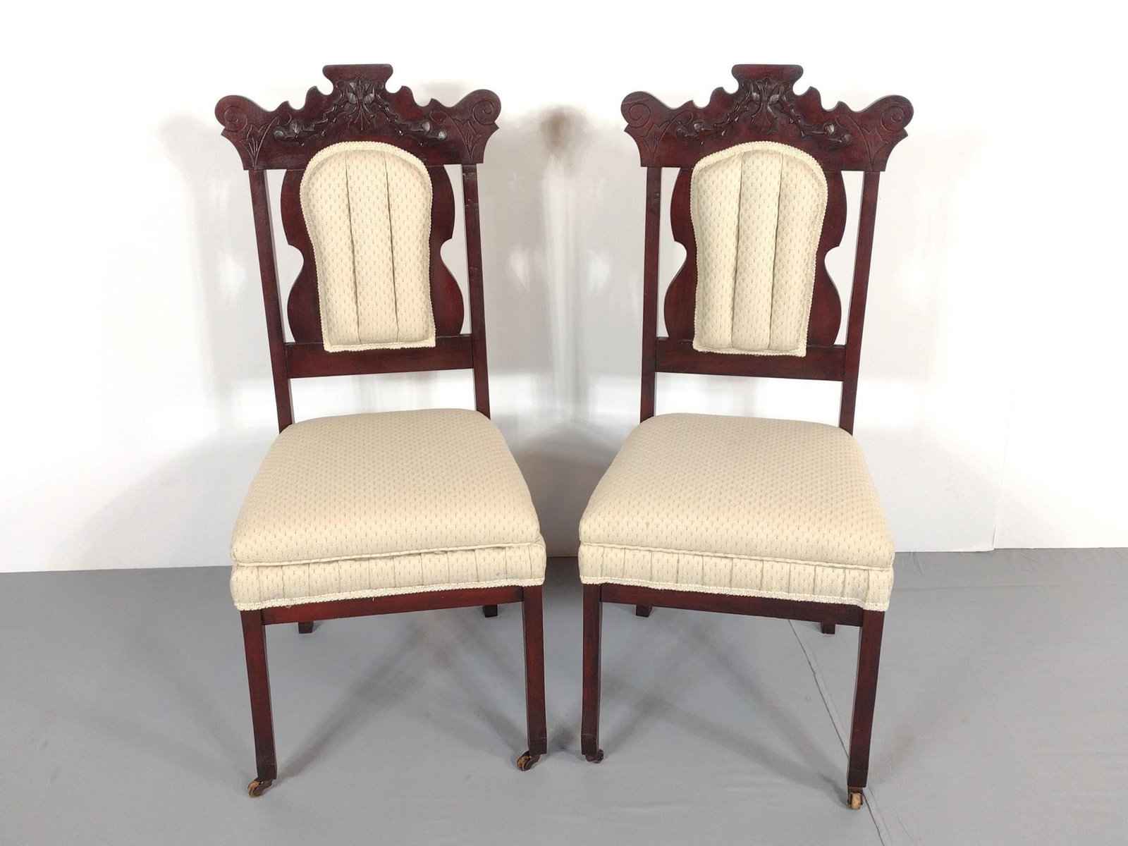 Pair of Carved and Upholstered Side Chairs: NOT ELIGIBLE FOR IN-HOUSE SHIPPING. Each 17" wide X 19" deep X 38-3/4" high. No manufactures name found.