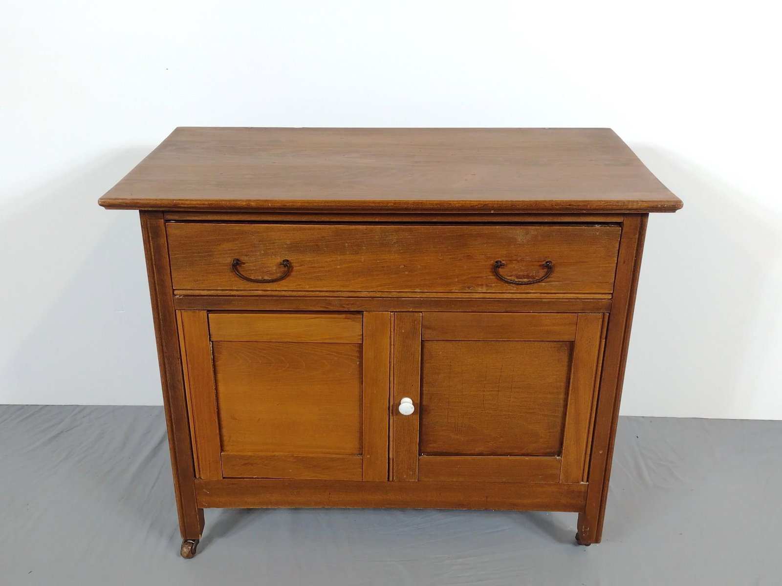 Double Door Single Drawer Wash Stand: NOT ELIGIBLE FOR IN-HOUSE SHIPPING. 33" wide X 17-1/4" deep X 27-1/4" high. Has some light scratches and small areas of discoloring.