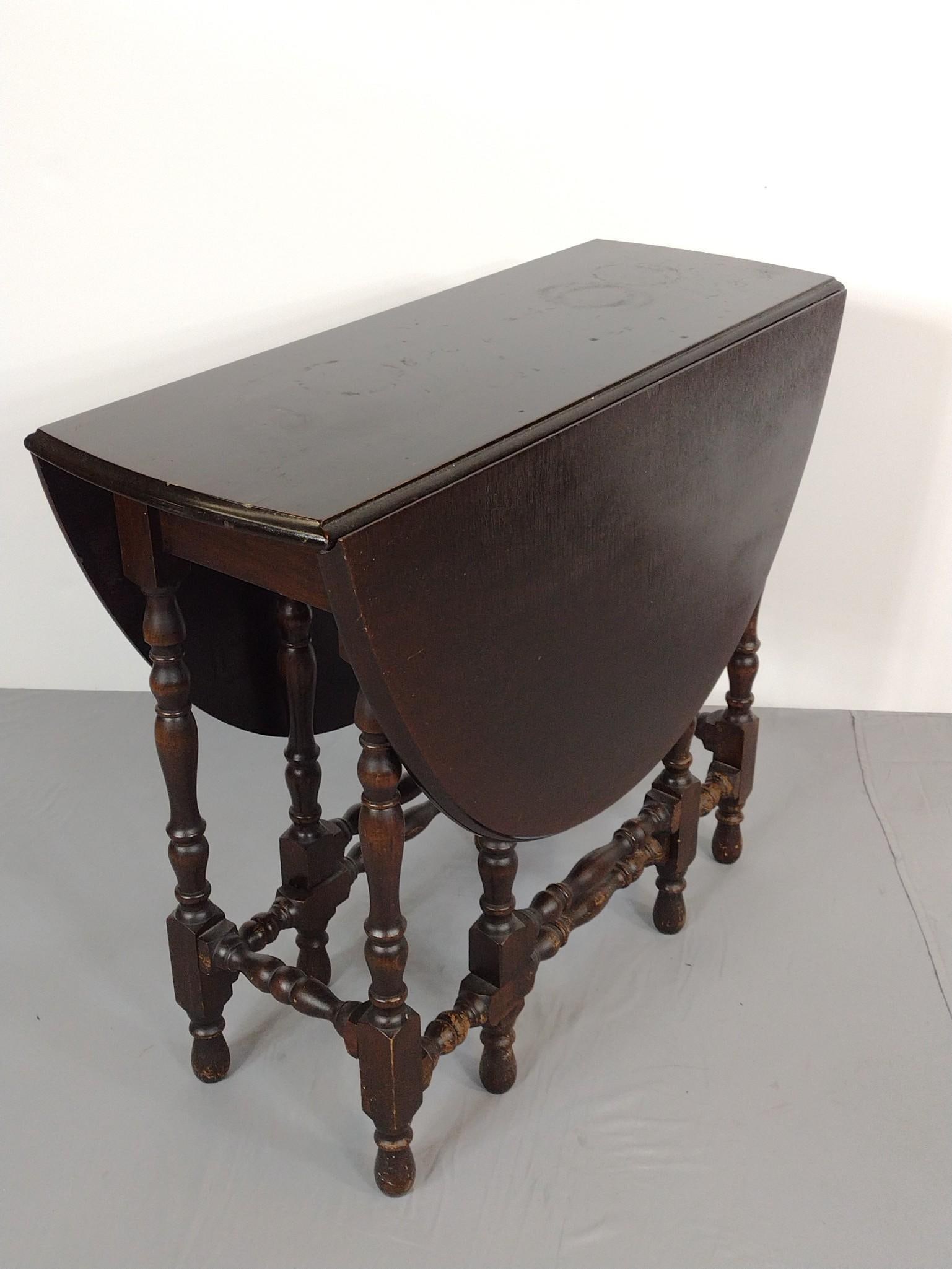 Gate Leg Table: NOT ELIGIBLE FOR IN-HOUSE SHIPPING. Open 49", closed 14" wide X 36" deep X 30-1/2" high. Has scratches and finish loss.
