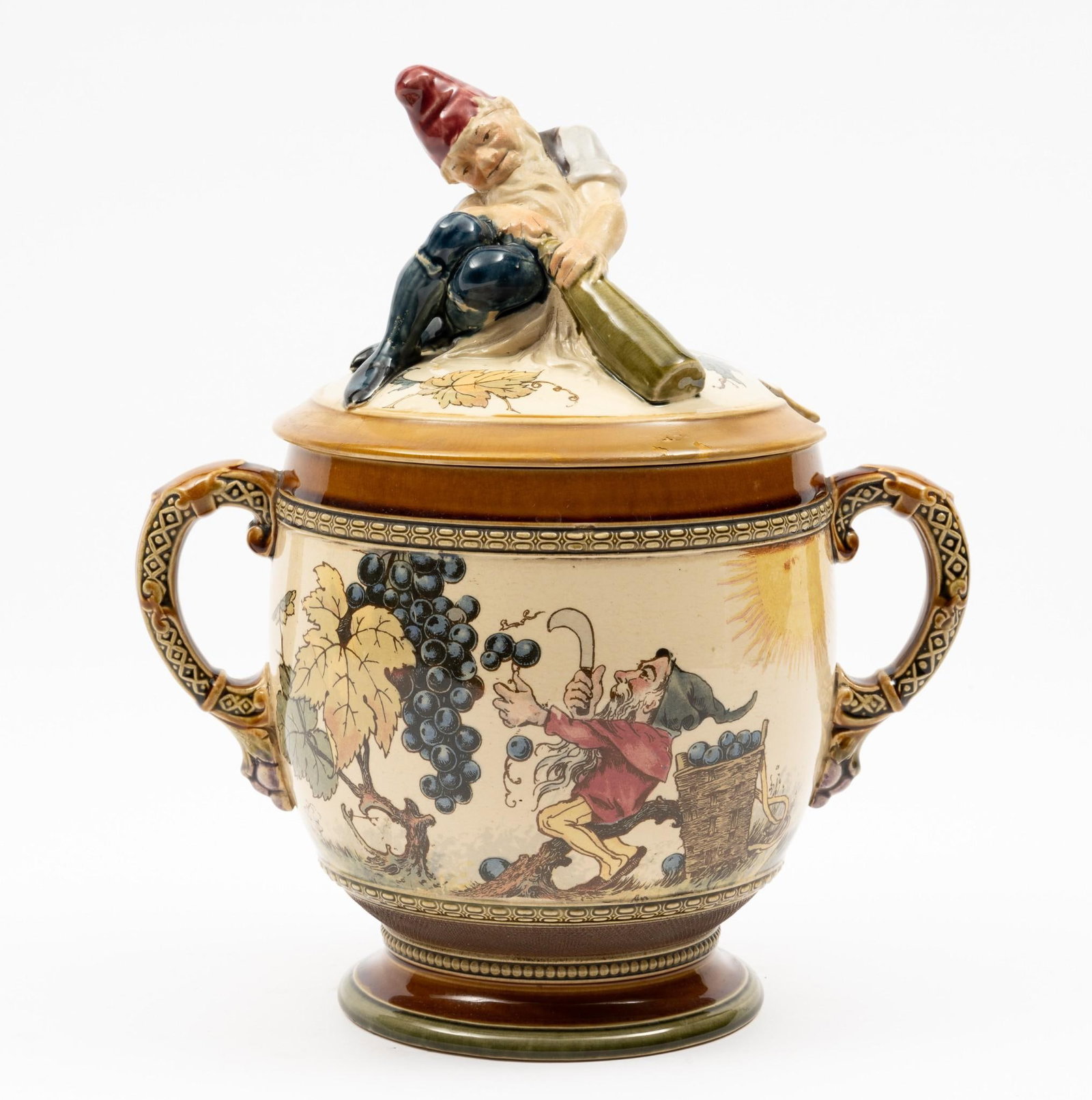 Mettlach Gnome Canister: 9" wide x 6-1/2" deep x 11" high. Some discoloration to interior.